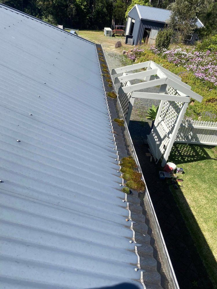 An Aerial View Of A Gutter On The Roof Of A House — The Guttering Cleaning Man in Nabiac, NSW