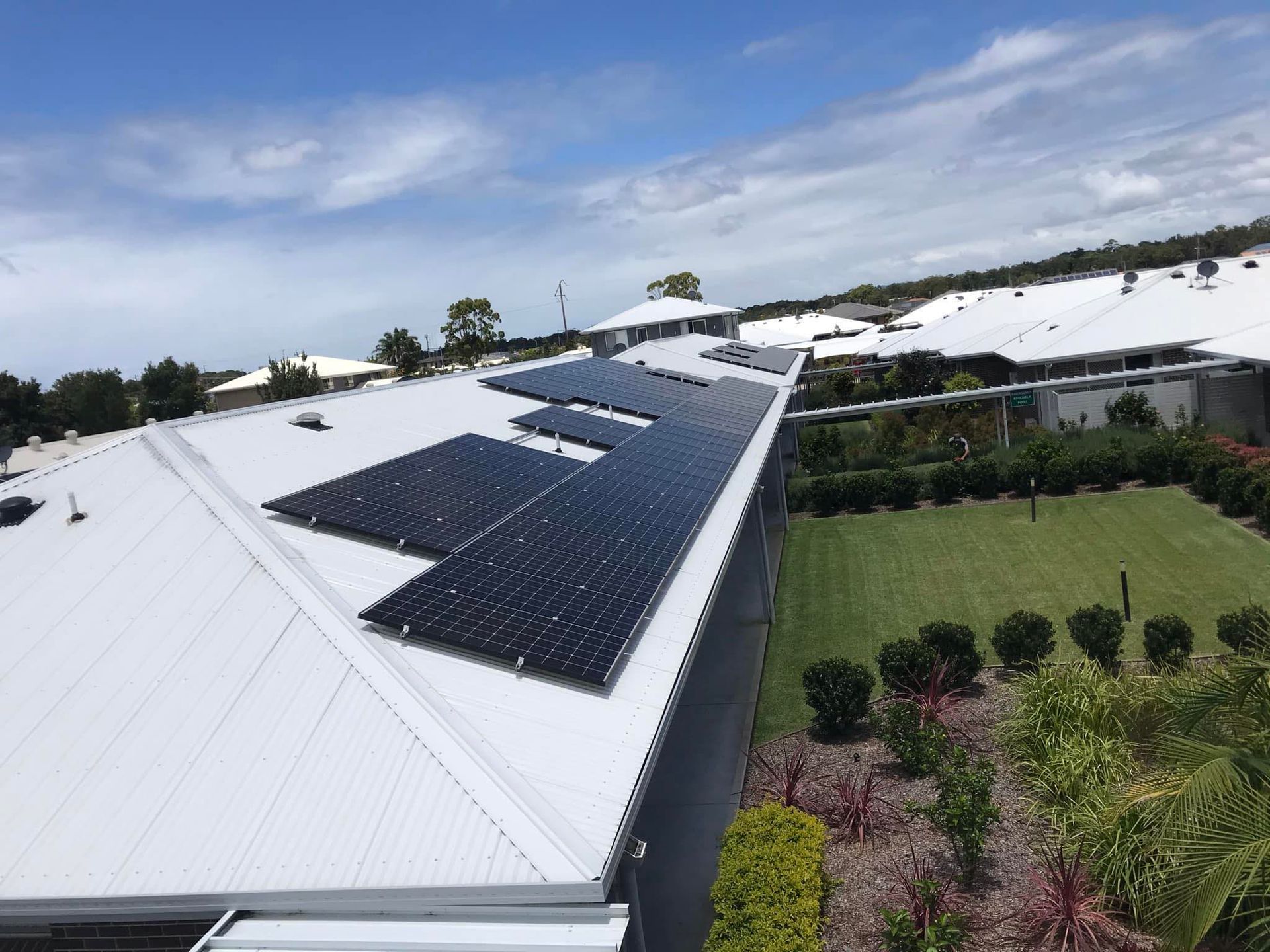 A Roof With A Satellite Dish On Top Of It — The Guttering Cleaning Man in Forster, NSW