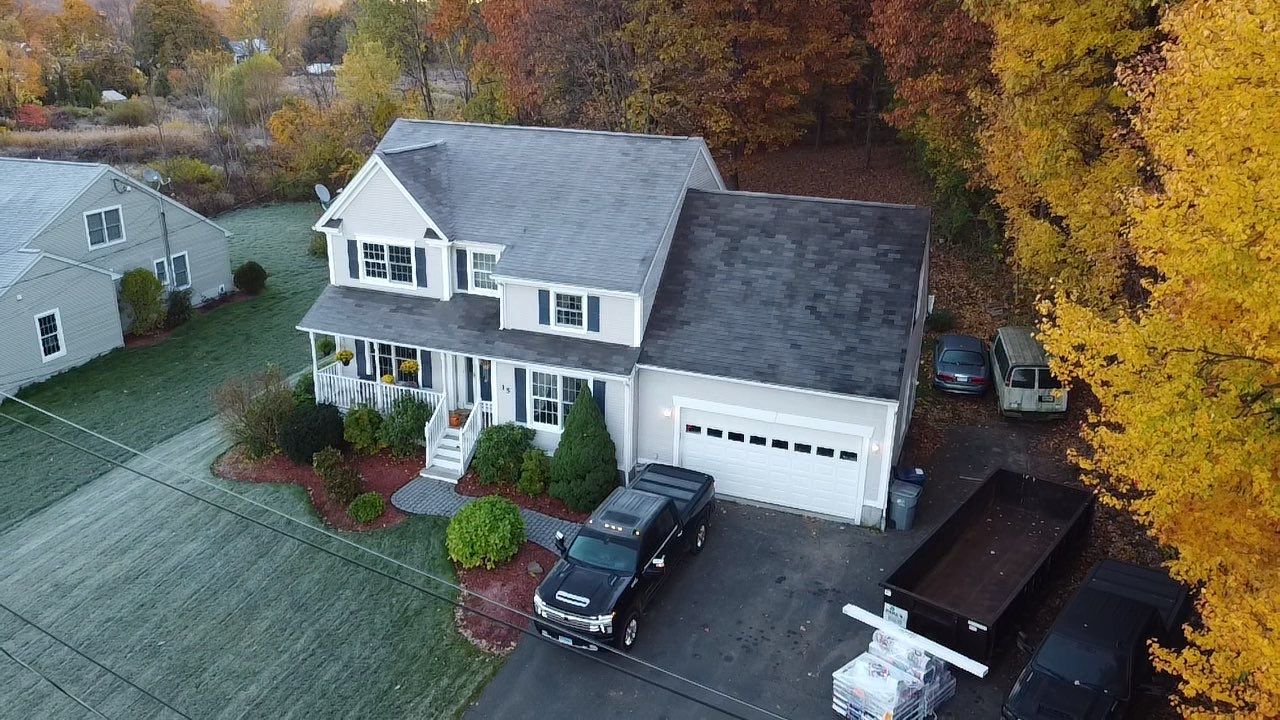 Colonial Home with Metal and Asphalt Roofing in Canton, CT