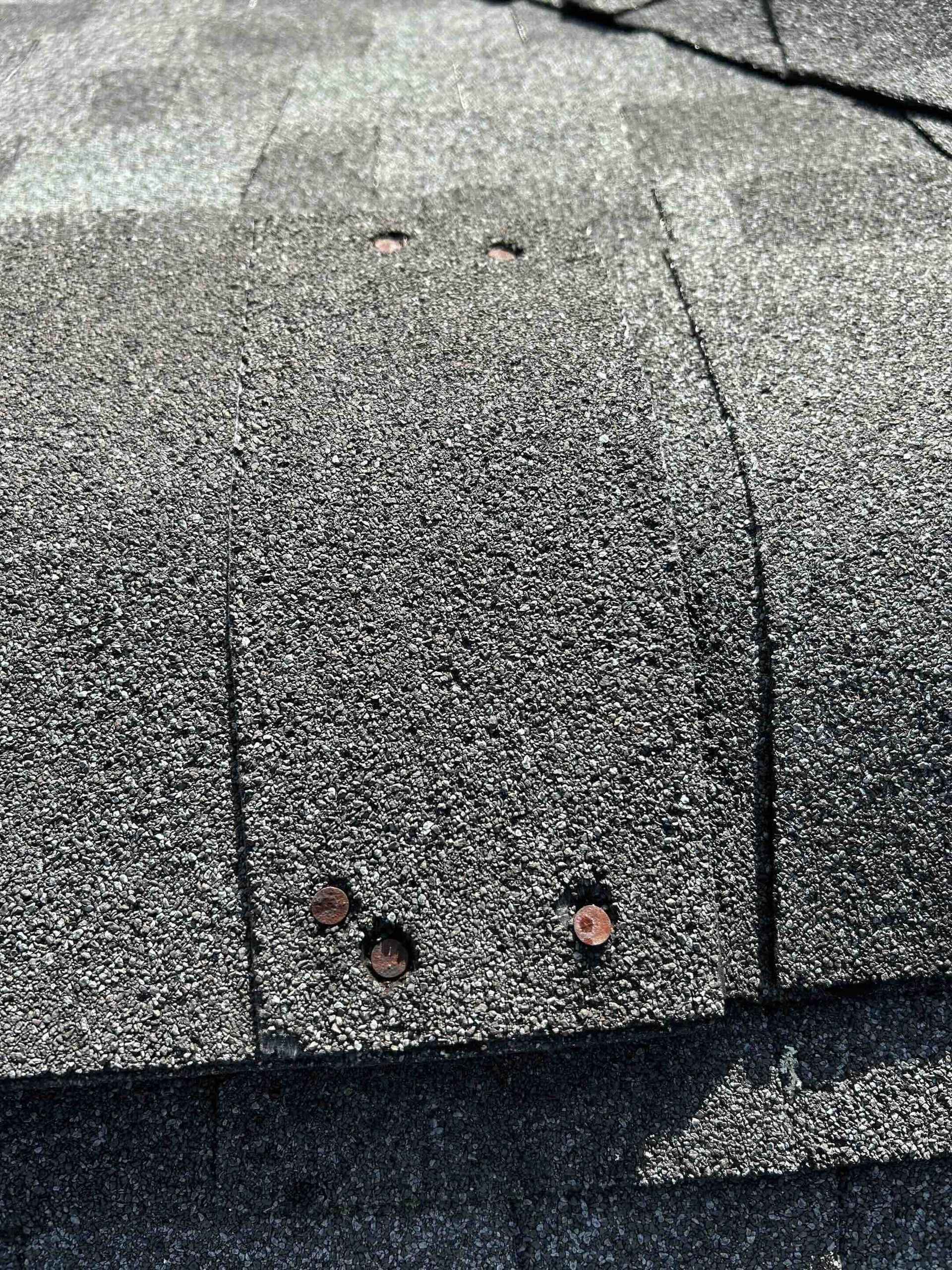 nail pops on ridge cap that are potential leak points on house roof