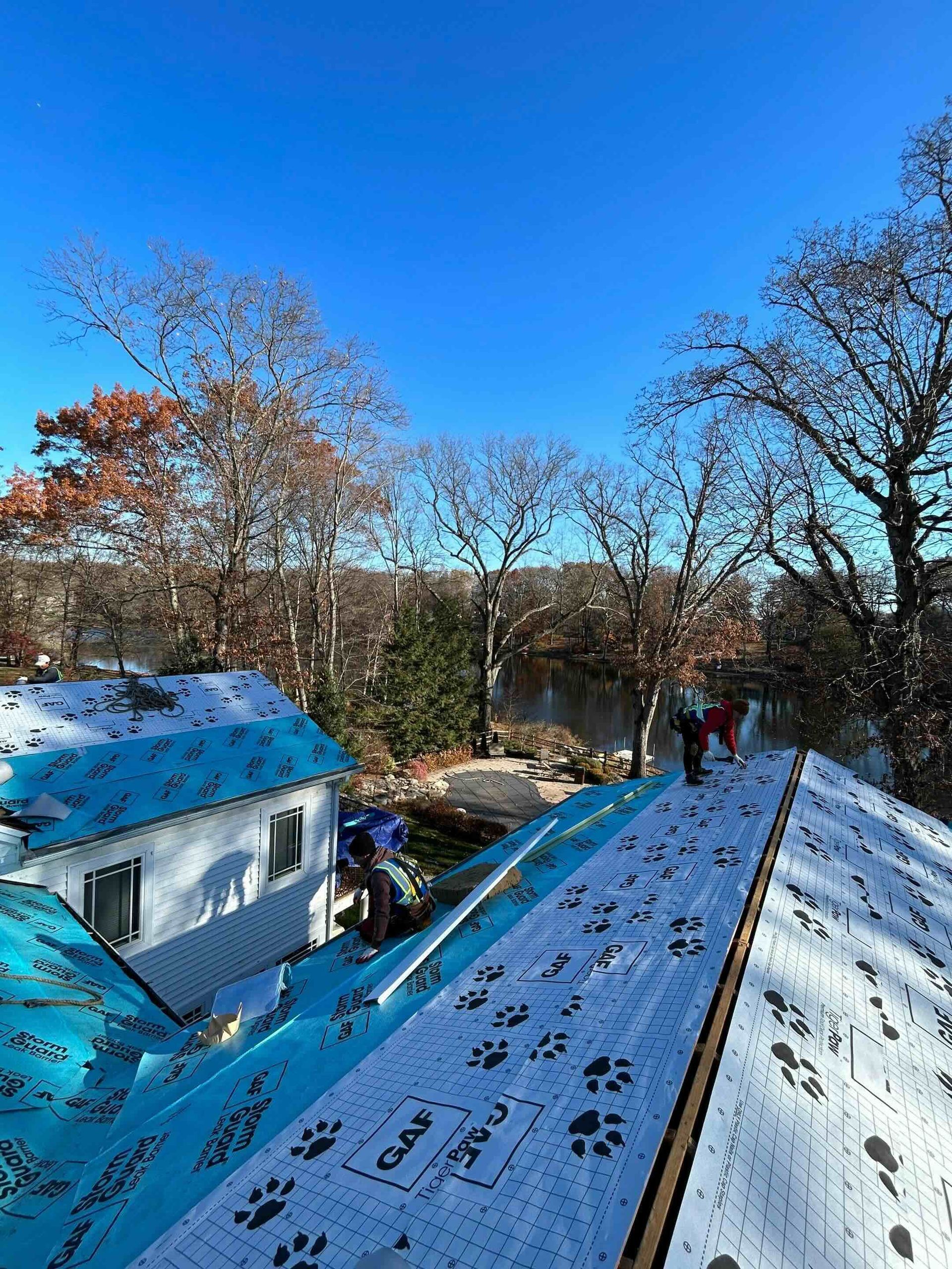 Professional Contractor installing GAF Storm Guard and Tiger Paw Underlayment on Wood Pond, West Hartford Residential Property