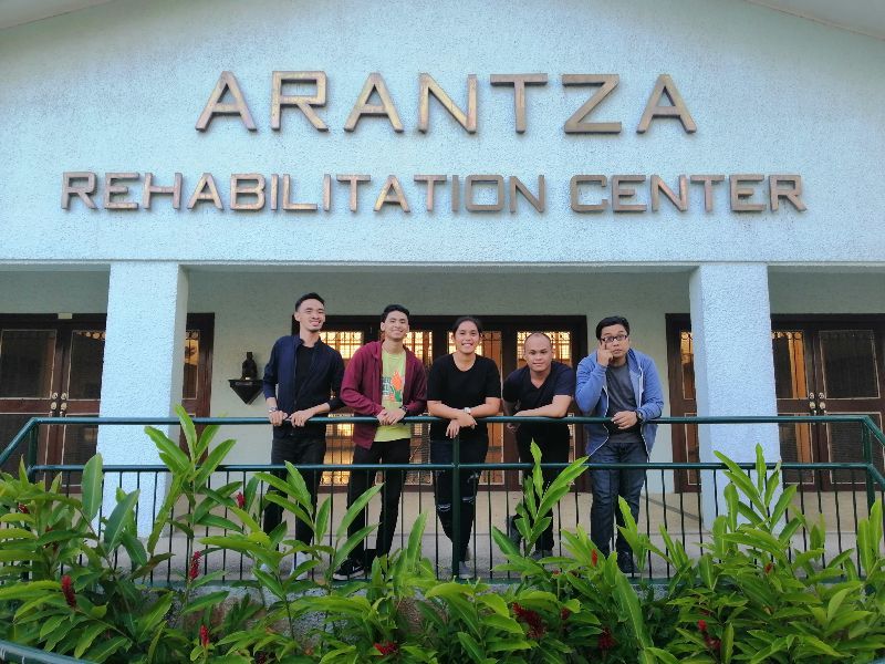 A group of people standing in front of the arantza rehabilitation center