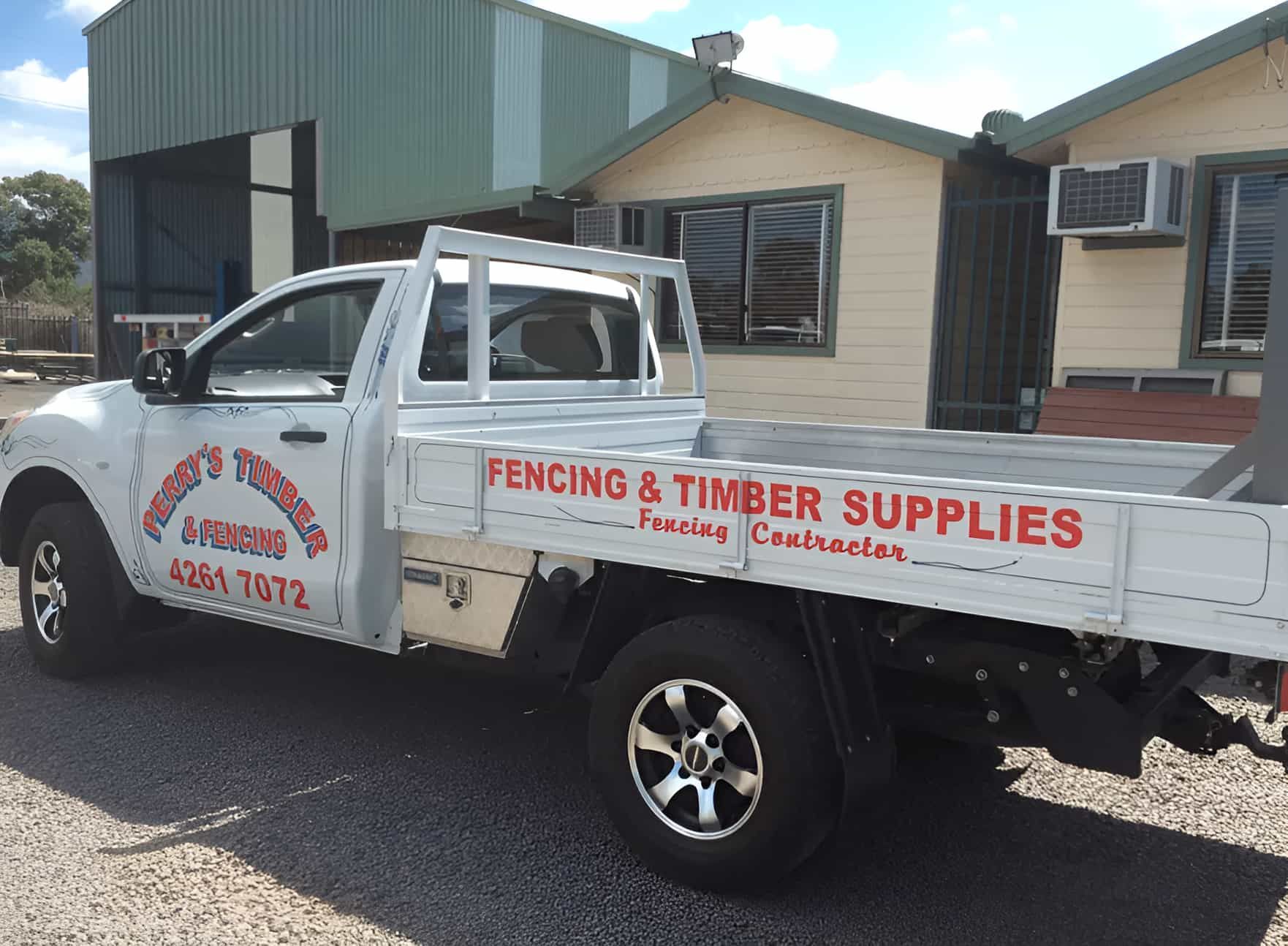 A Truck Is Parked In Front Of A Building That Says Fencing & Timber Supplies — Perry's Timber & Fencing In Dapto, NSW