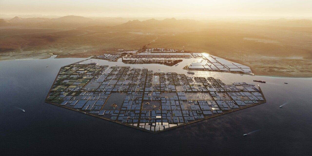 An aerial view of a city on a small island in the middle of the ocean.