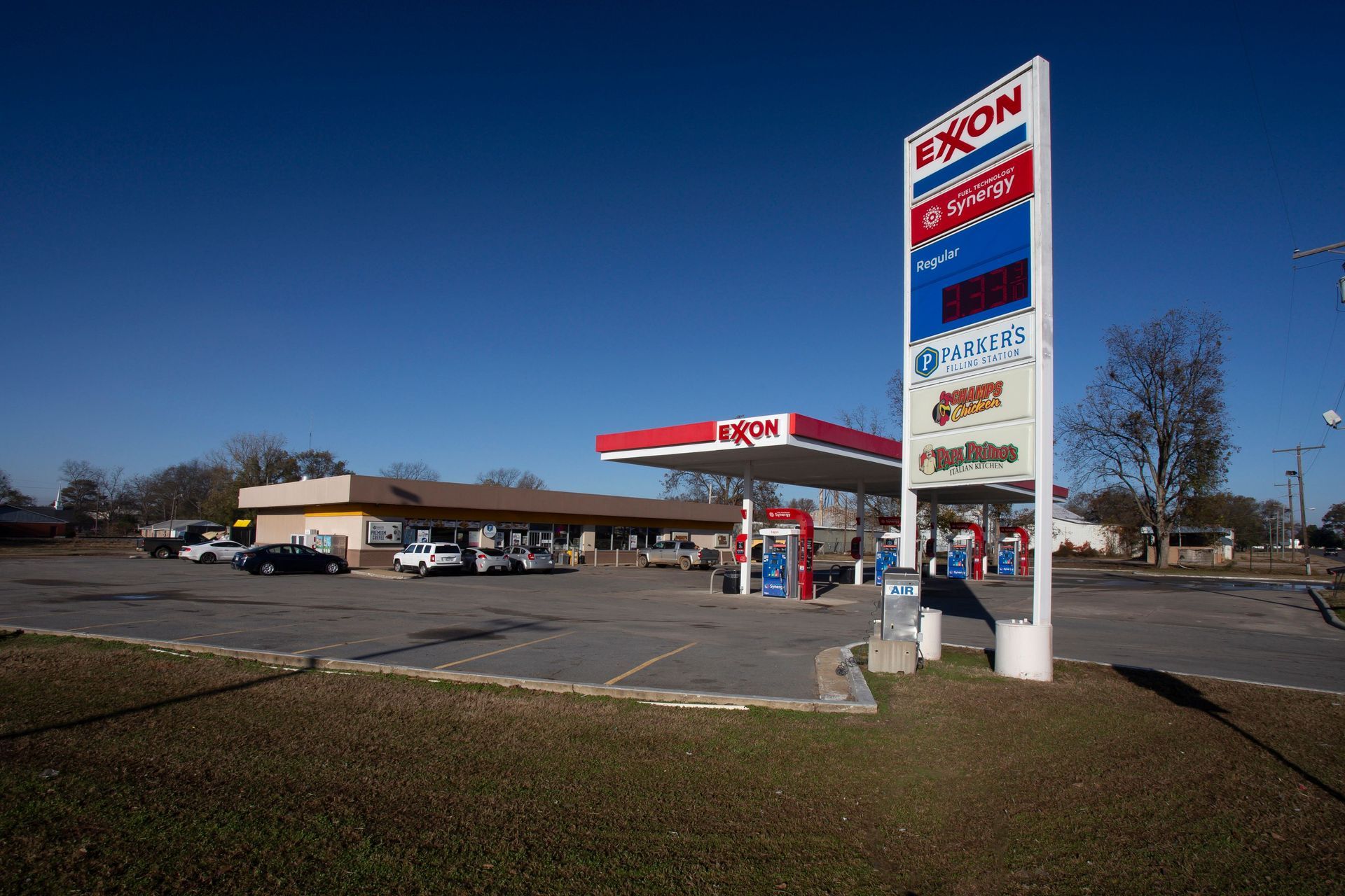 A gas station with a sign that says exxon on it.