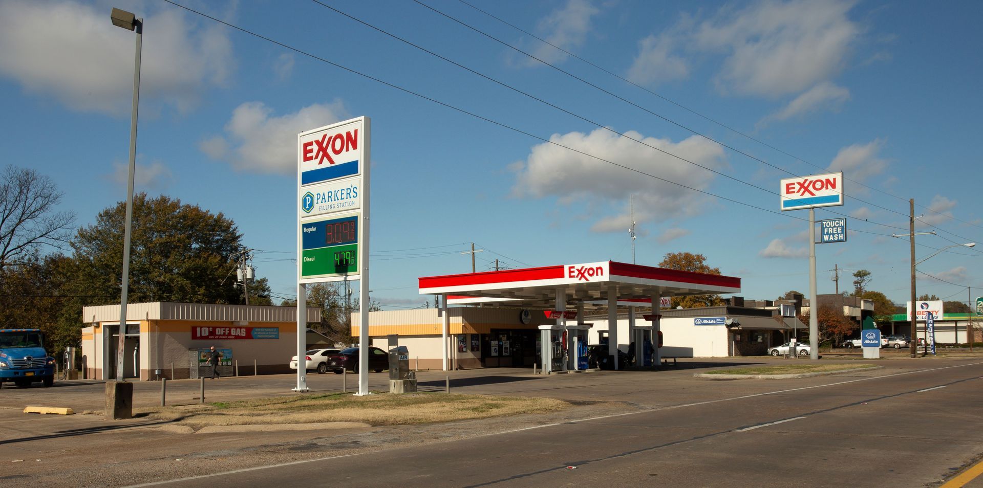 A gas station with a sign that says exxon on it