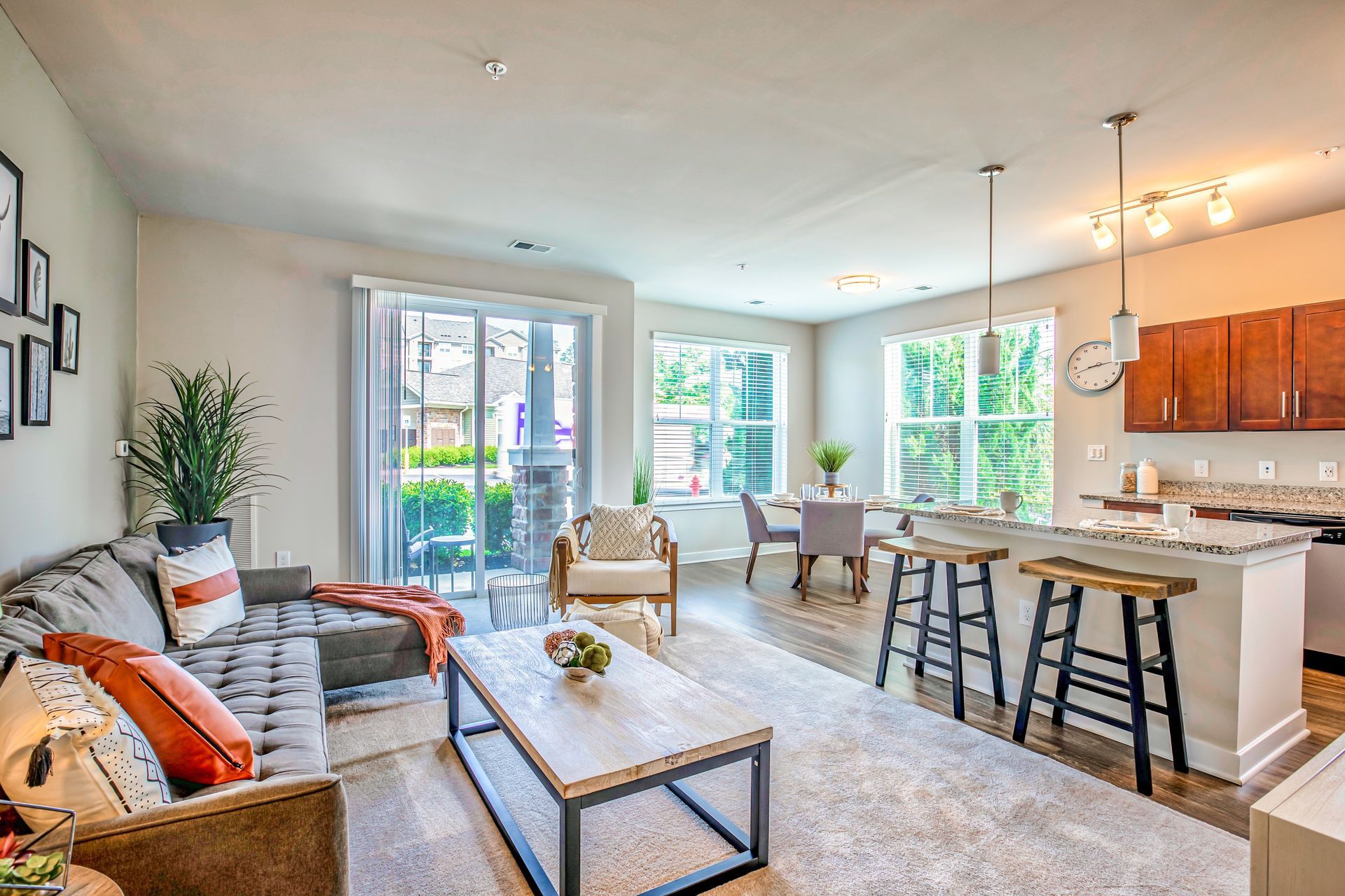 Living room and kitchen bar seating at The Park at Winters Run.
