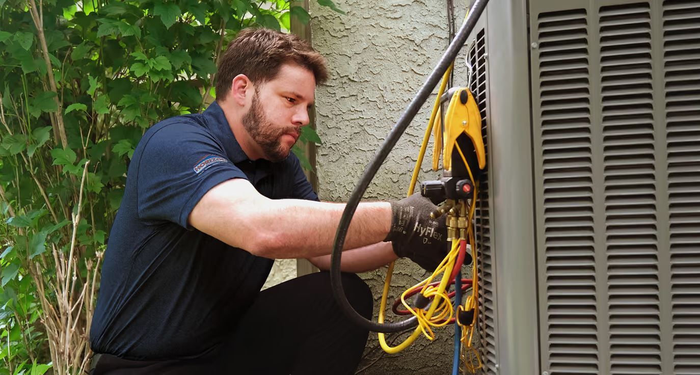 Technician conducting Spring Hill HVAC repair