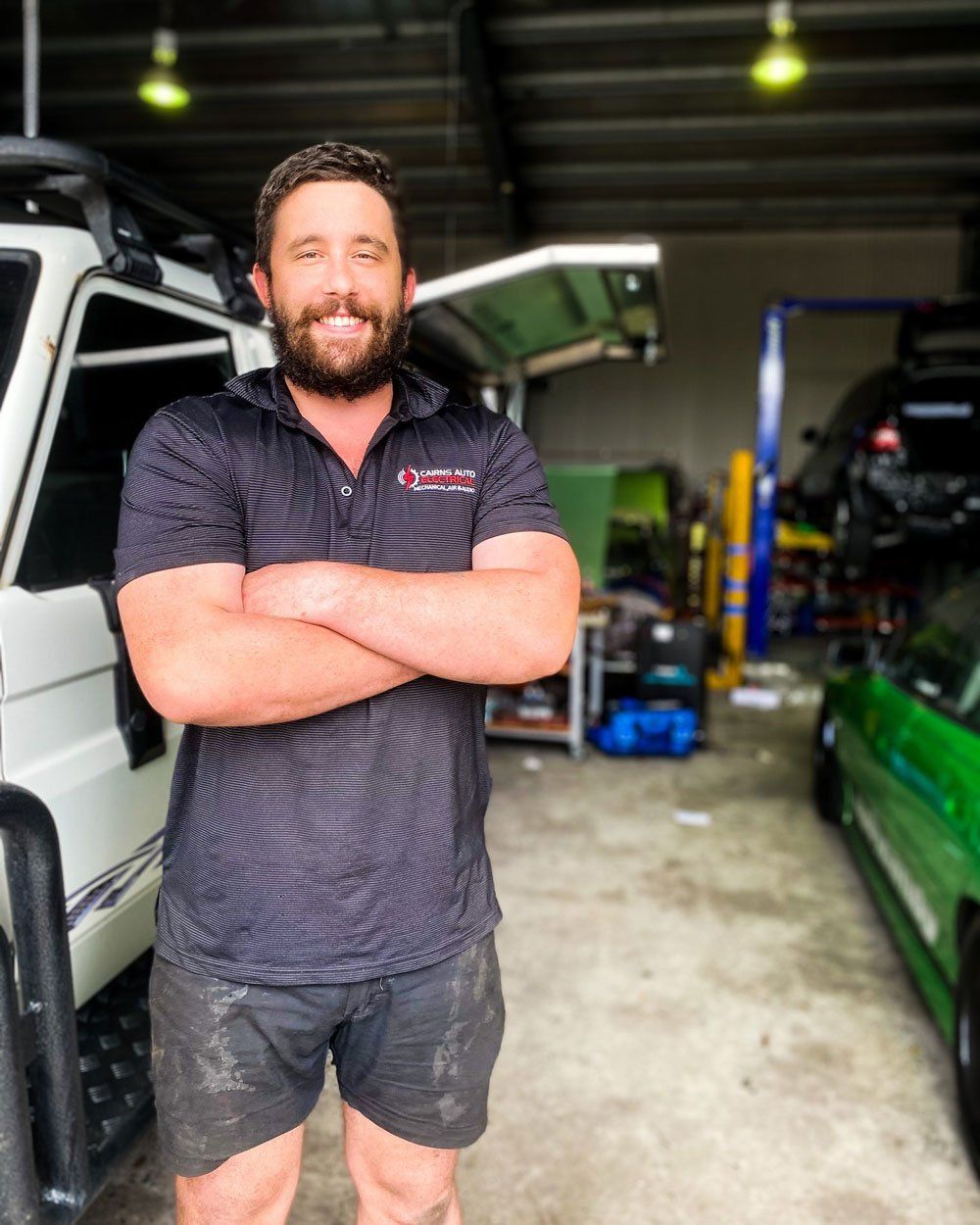 Jackson, a qualified mechanic standing inside a mechanic cairns workshop— Cairns Auto Electrical Mechanical Air & Audio in Stratford, QLD