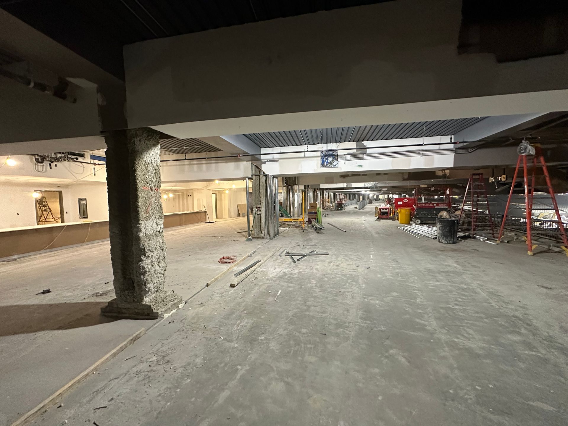 A construction site with a lot of concrete and a lot of workers.