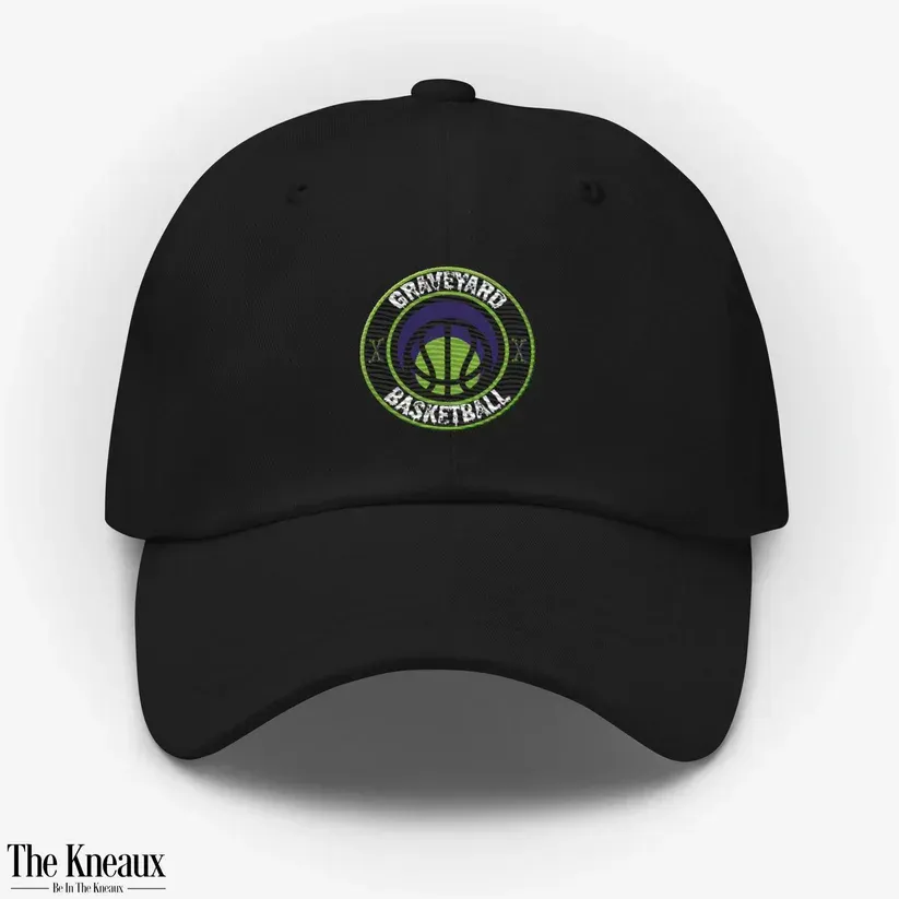 A black baseball cap that says graveyard basketball on it