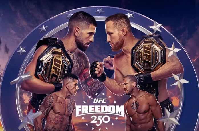 Two fighters face off with championship belts over a UFC Freedom 250 event poster.