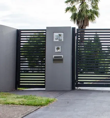A Grey Metal Slat Gate With Intercom and Letterbox — Waratah Home Improvements in Coledale, NSW