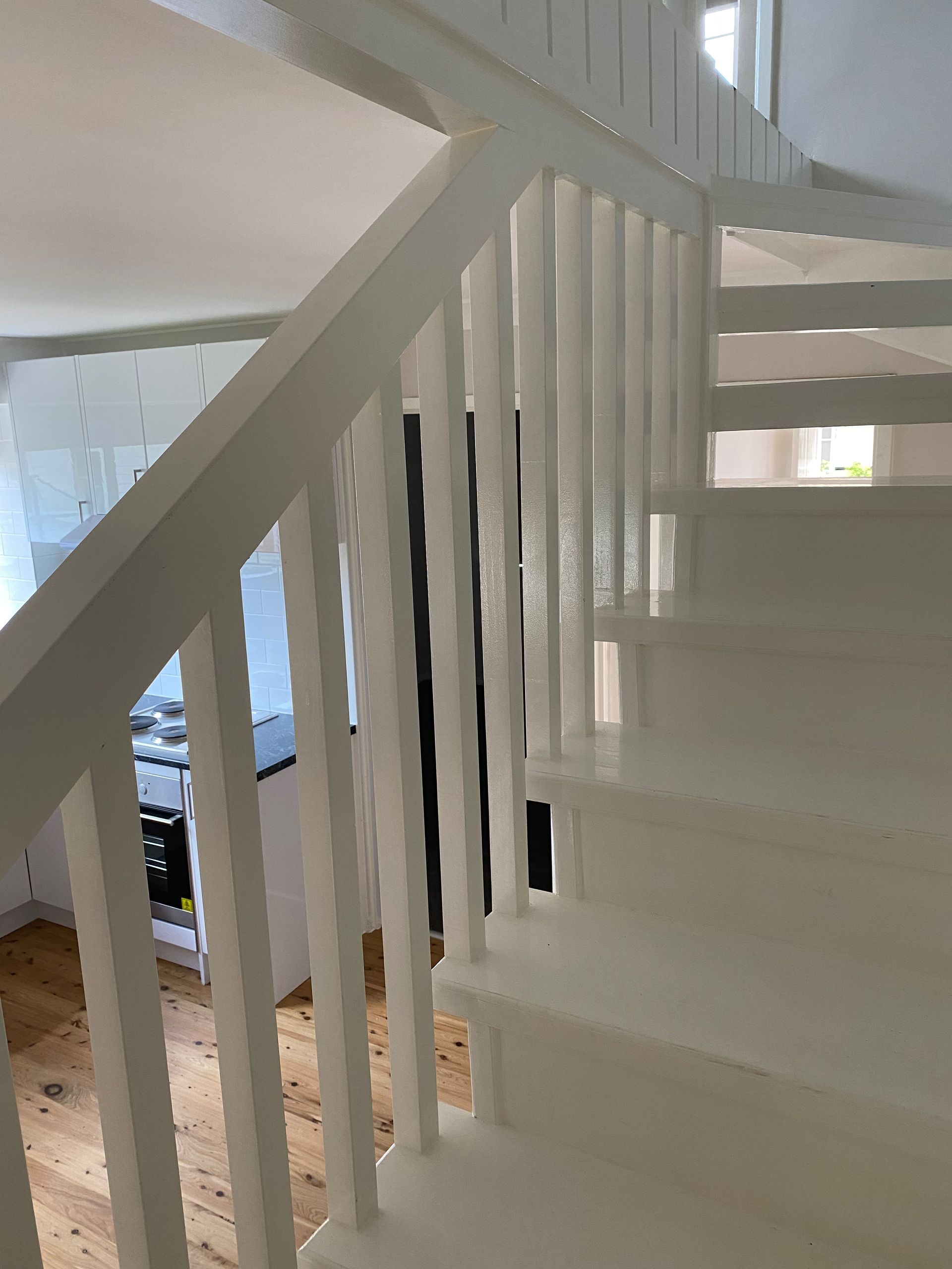 Person in Gloves Wiping a White Gutter — Waratah Home Improvements in Coledale, NSW