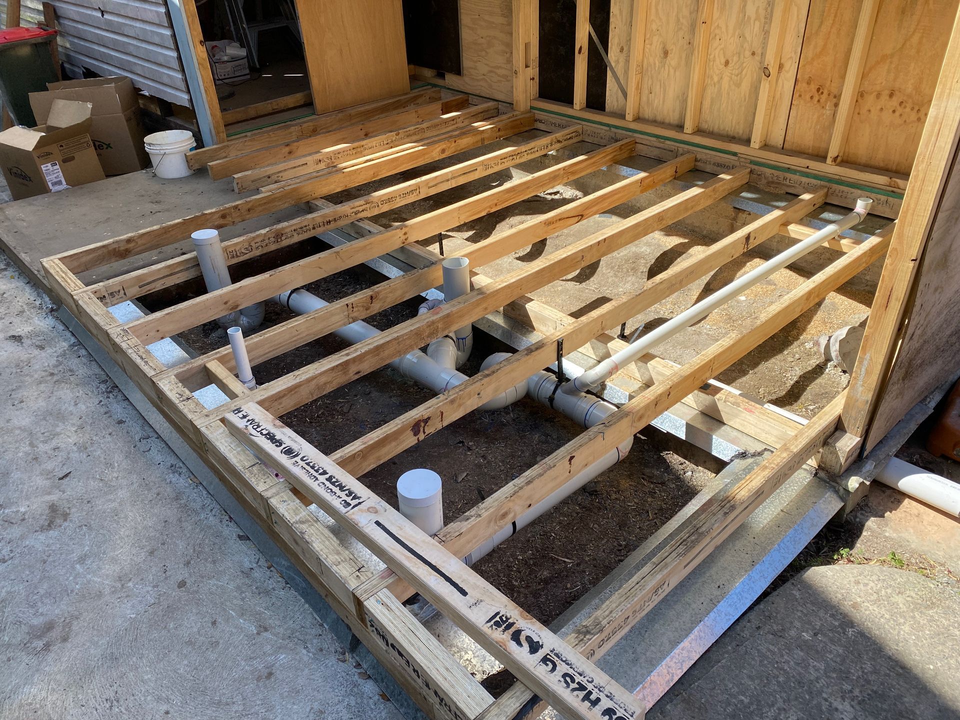 Person using a power drill to assemble a white cabinet. — Waratah Home Improvements in Coledale, NSW