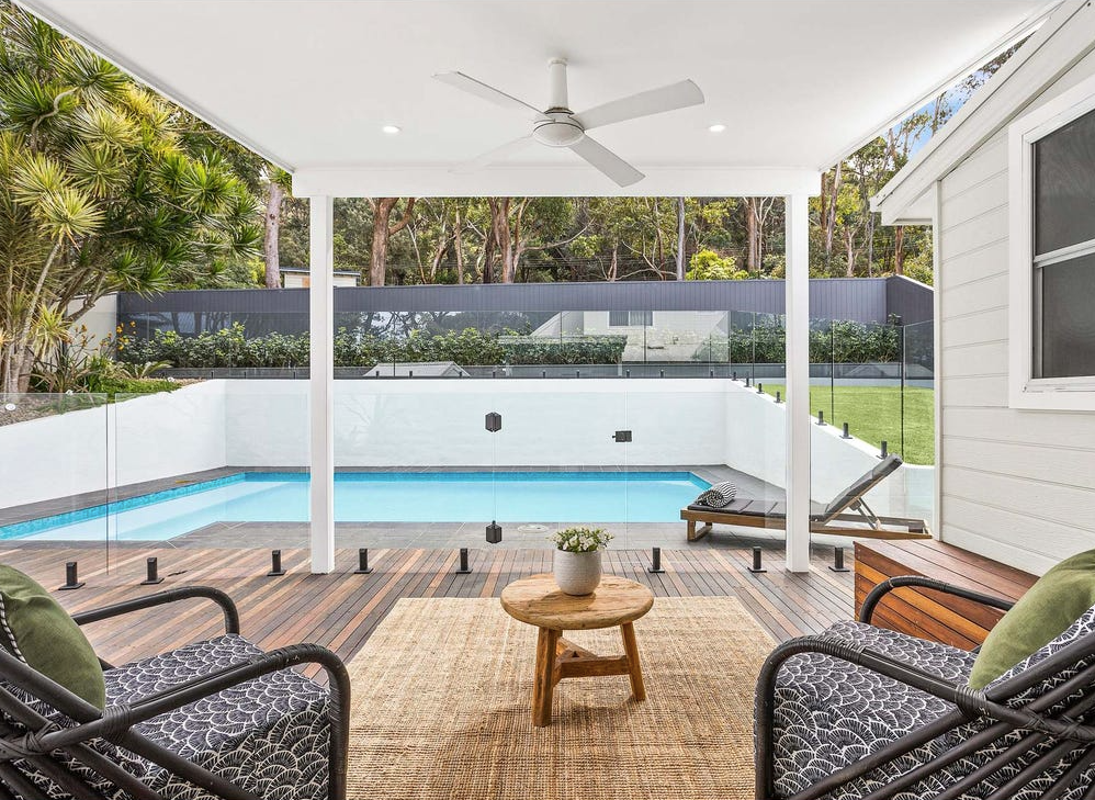 Modern House With Pool; Glass Fence, Sliding Doors and Blue Water — Waratah Home Improvements in Coledale, NSW