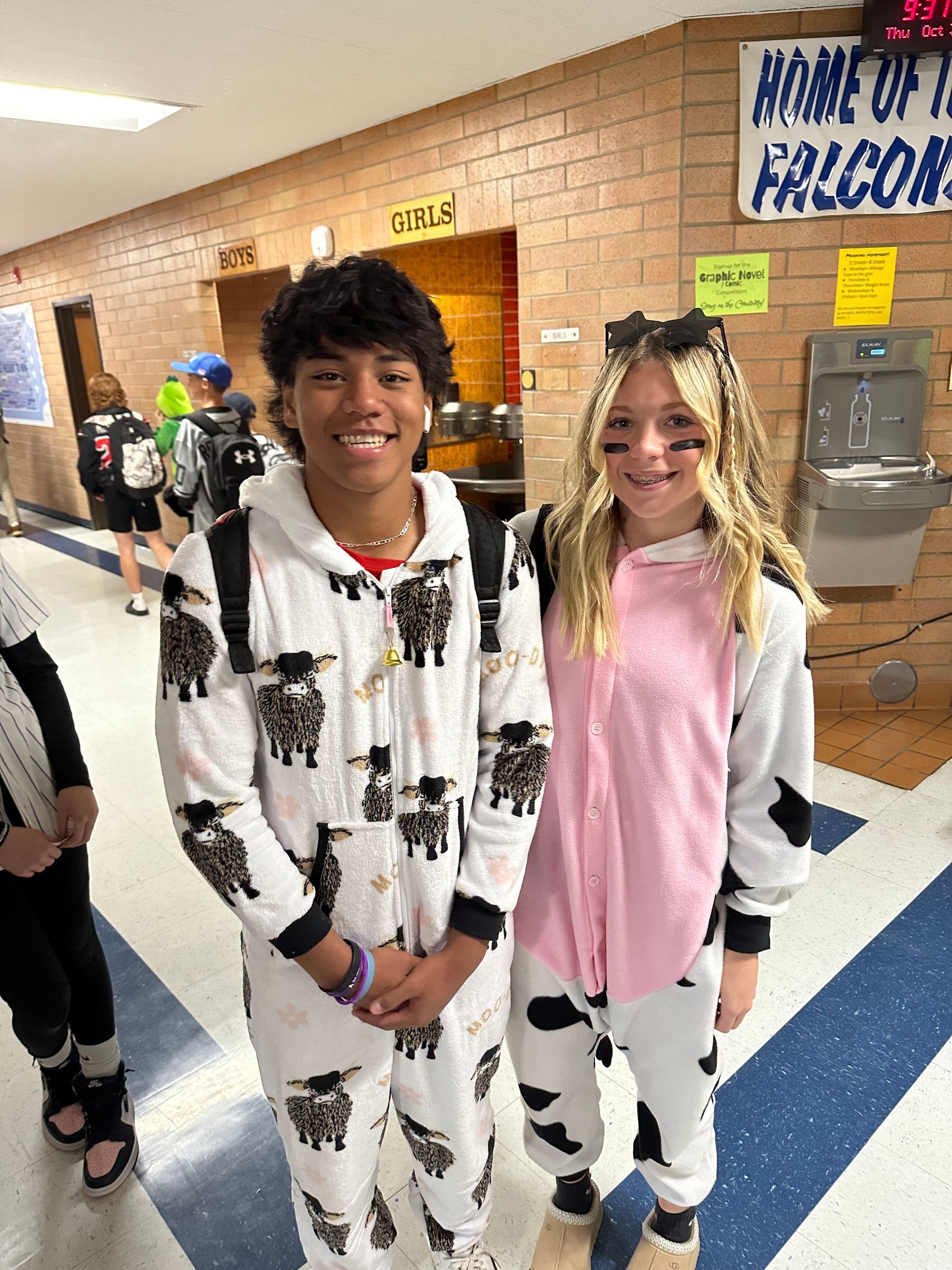 two students dressed as cows