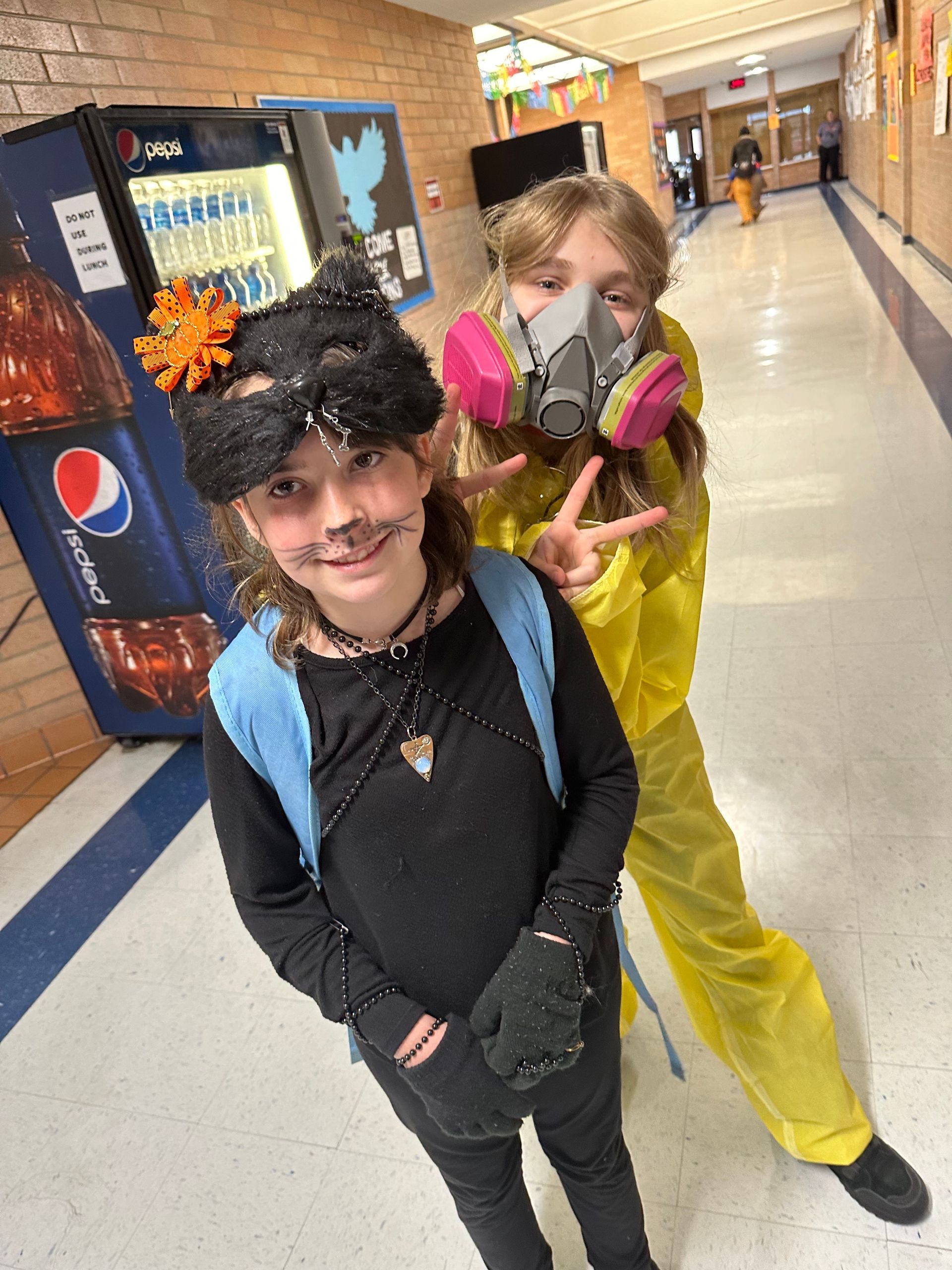 two students in hall dressed up for Halloween
