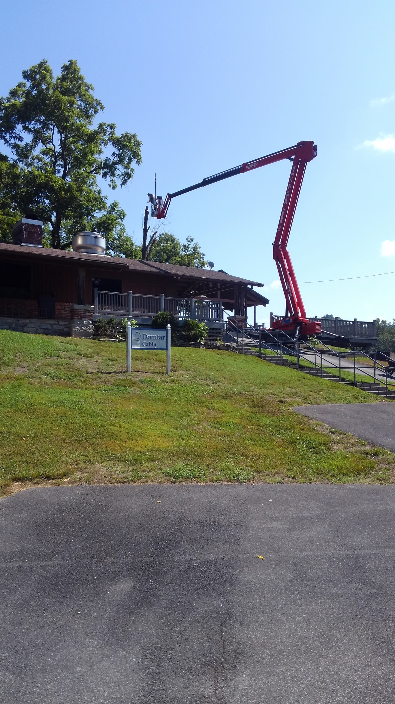 Worker chops down a tree — Church Hill, TN — Barrett’s Tree Experts