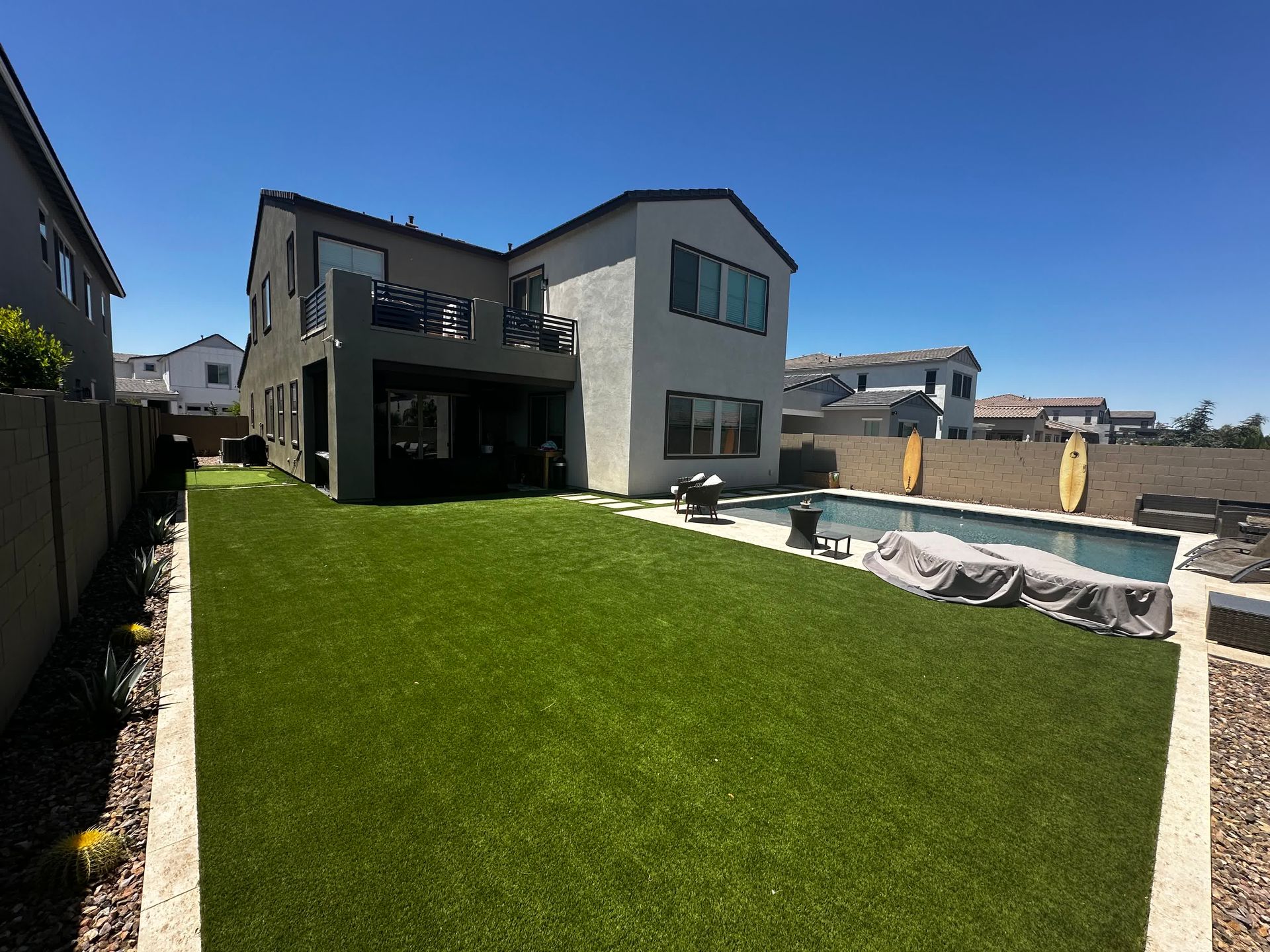 A large house with a swimming pool in the backyard.