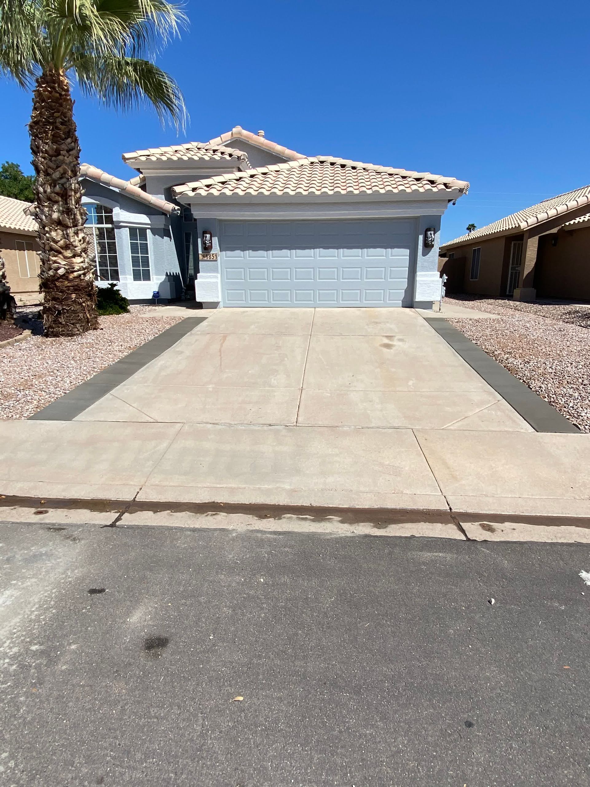 A house with a palm tree in front of it