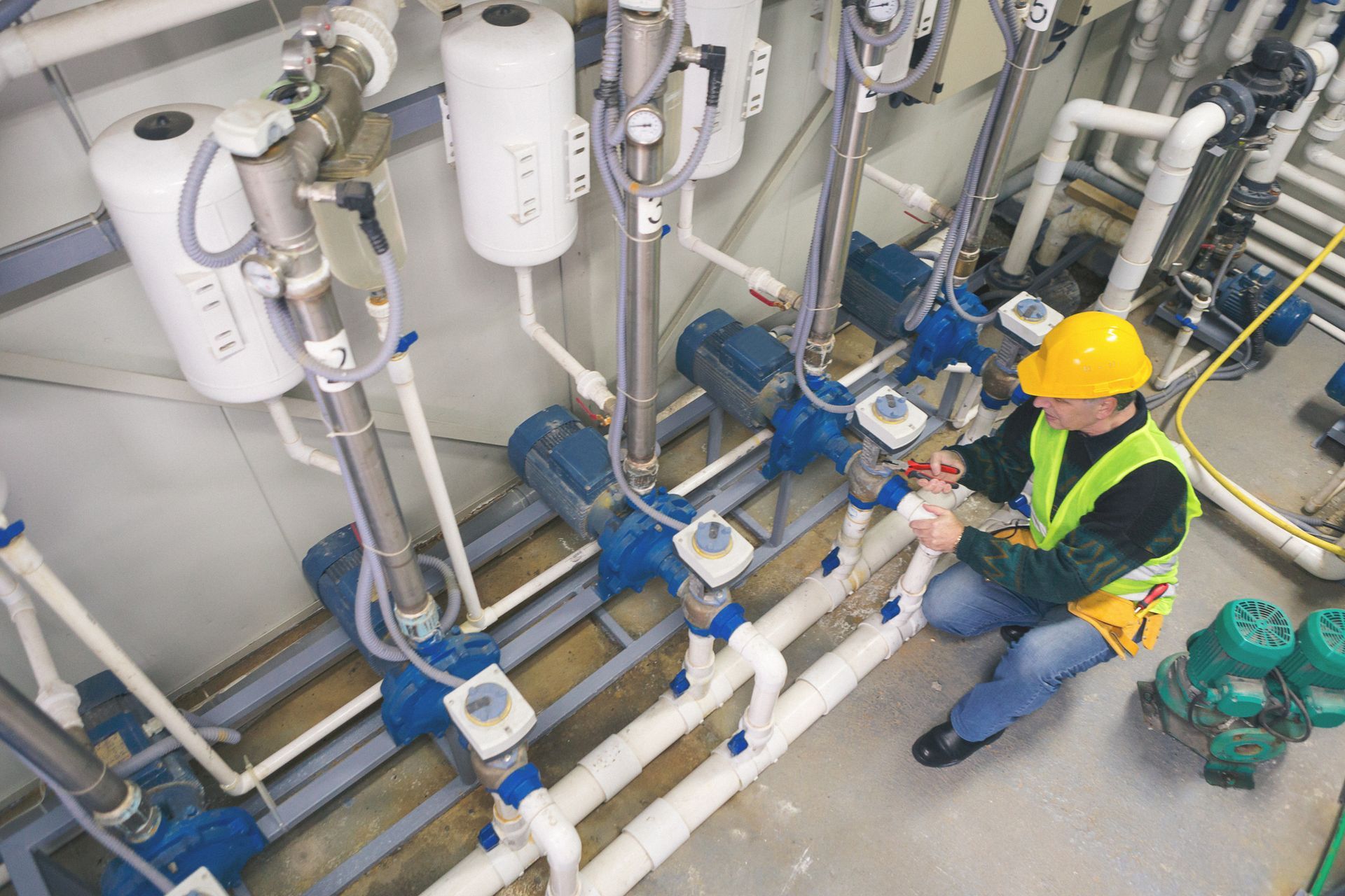 Engineer fixing water pipes
