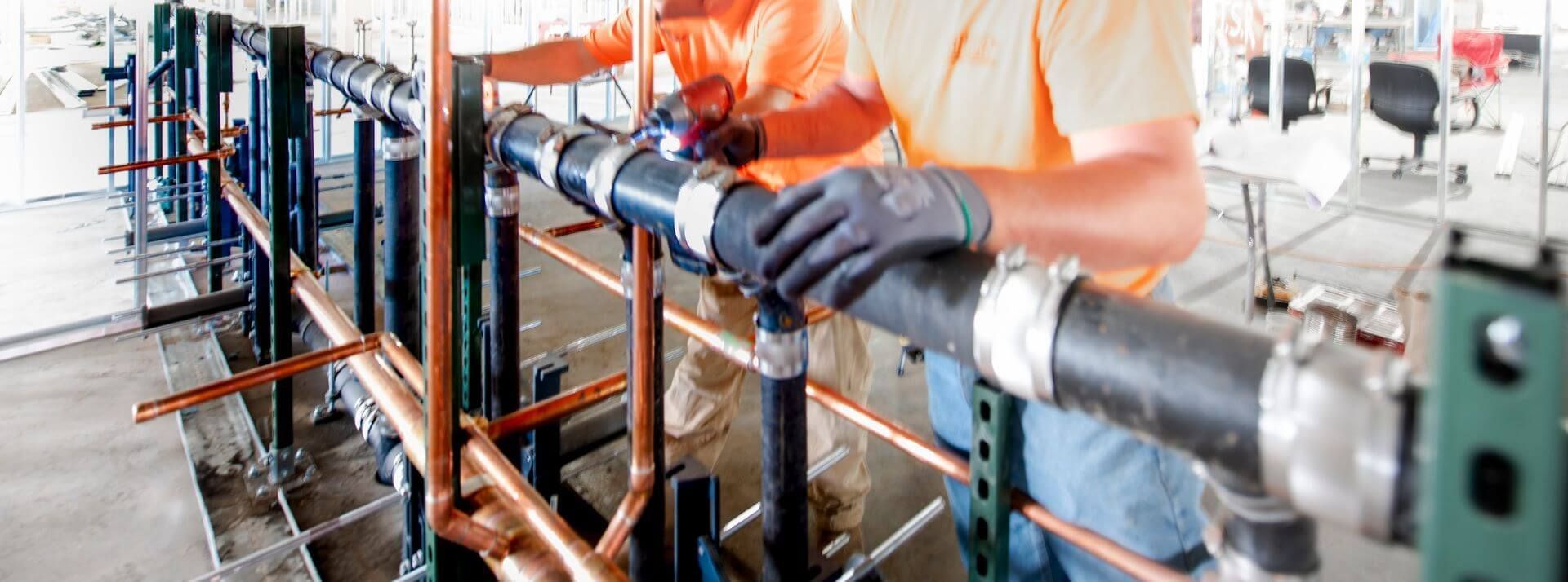 Workers installing pipes