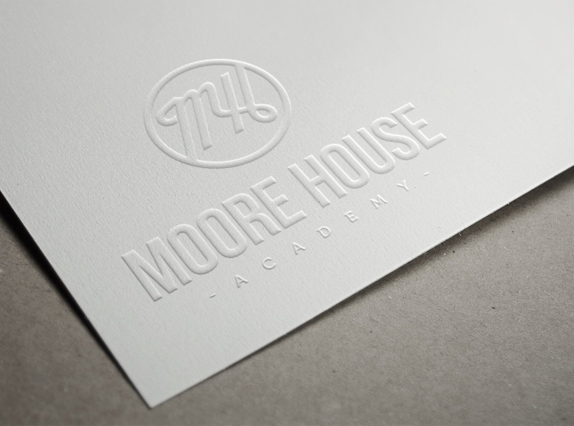 A white piece of paper with the word moore house embossed on it