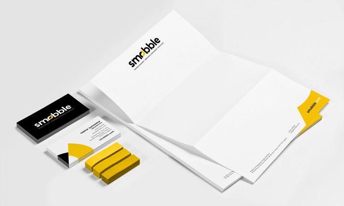 A mockup of a business card , letterhead , and envelope.