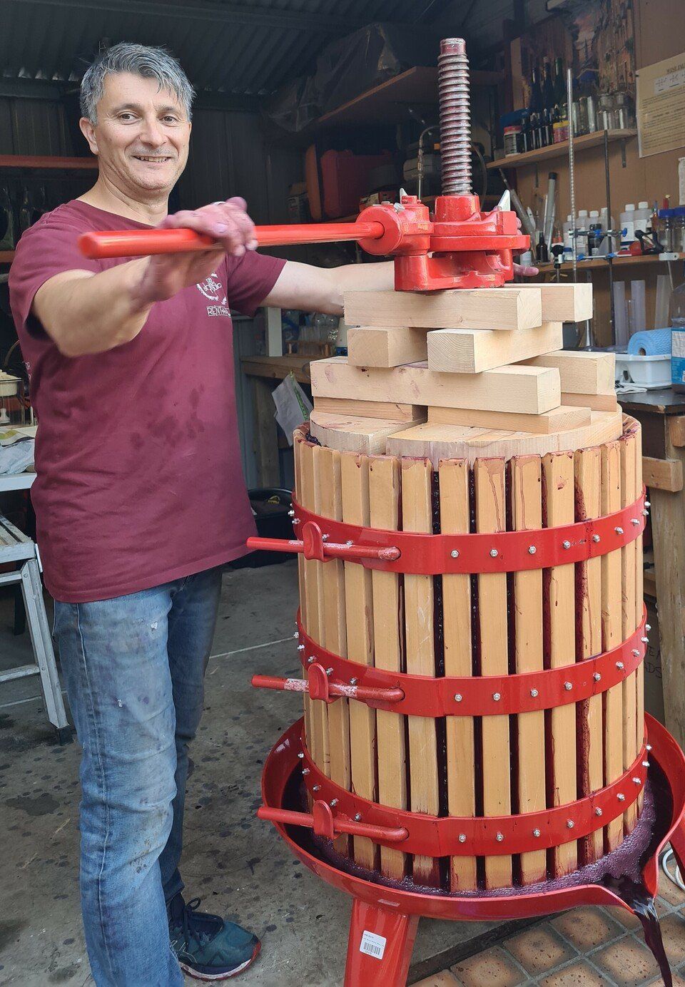 a person tight the box of wine