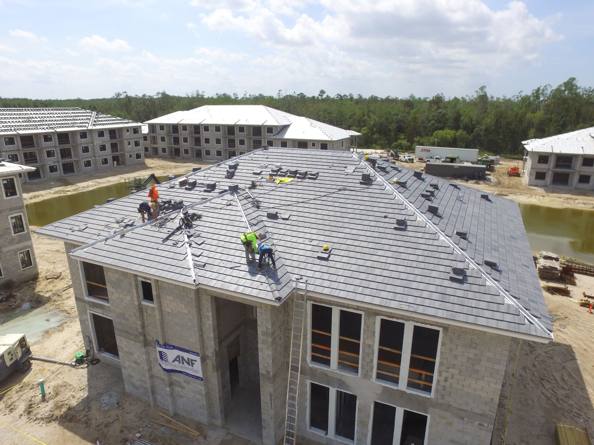 roof is being built with wooden beams and a chimney