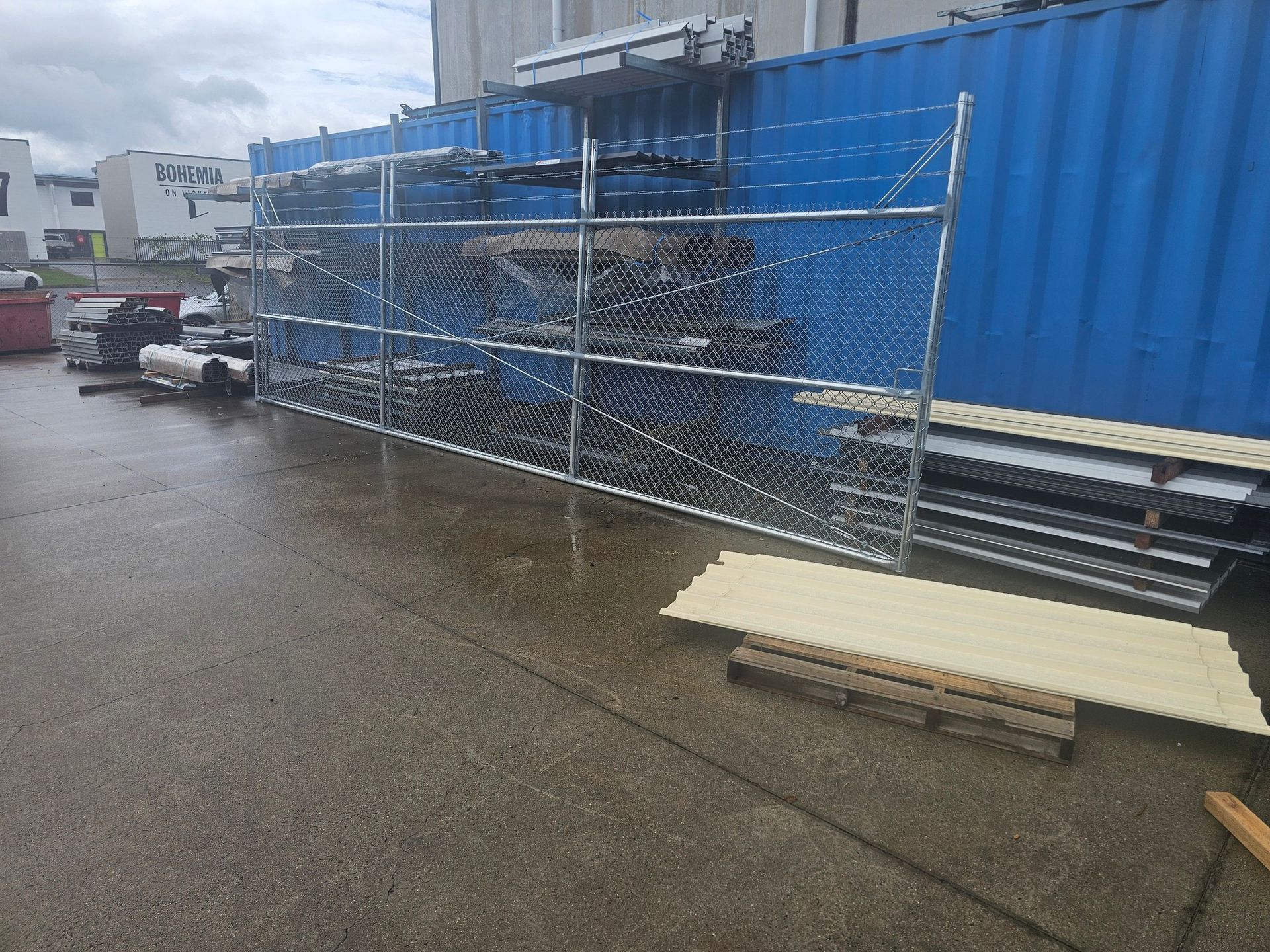 Blue Shipping Containers and Metal Fencing — KLS Fencing In Edmonton, QLD
