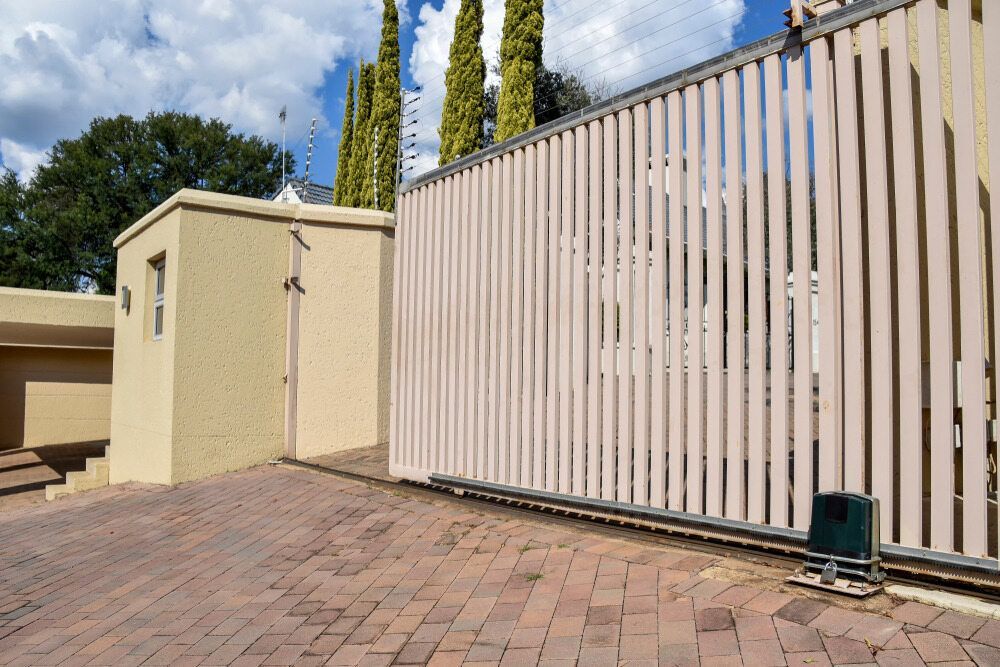 Beige Entrance Gate and Utility Door — KLS Fencing In Tablelands, QLD
