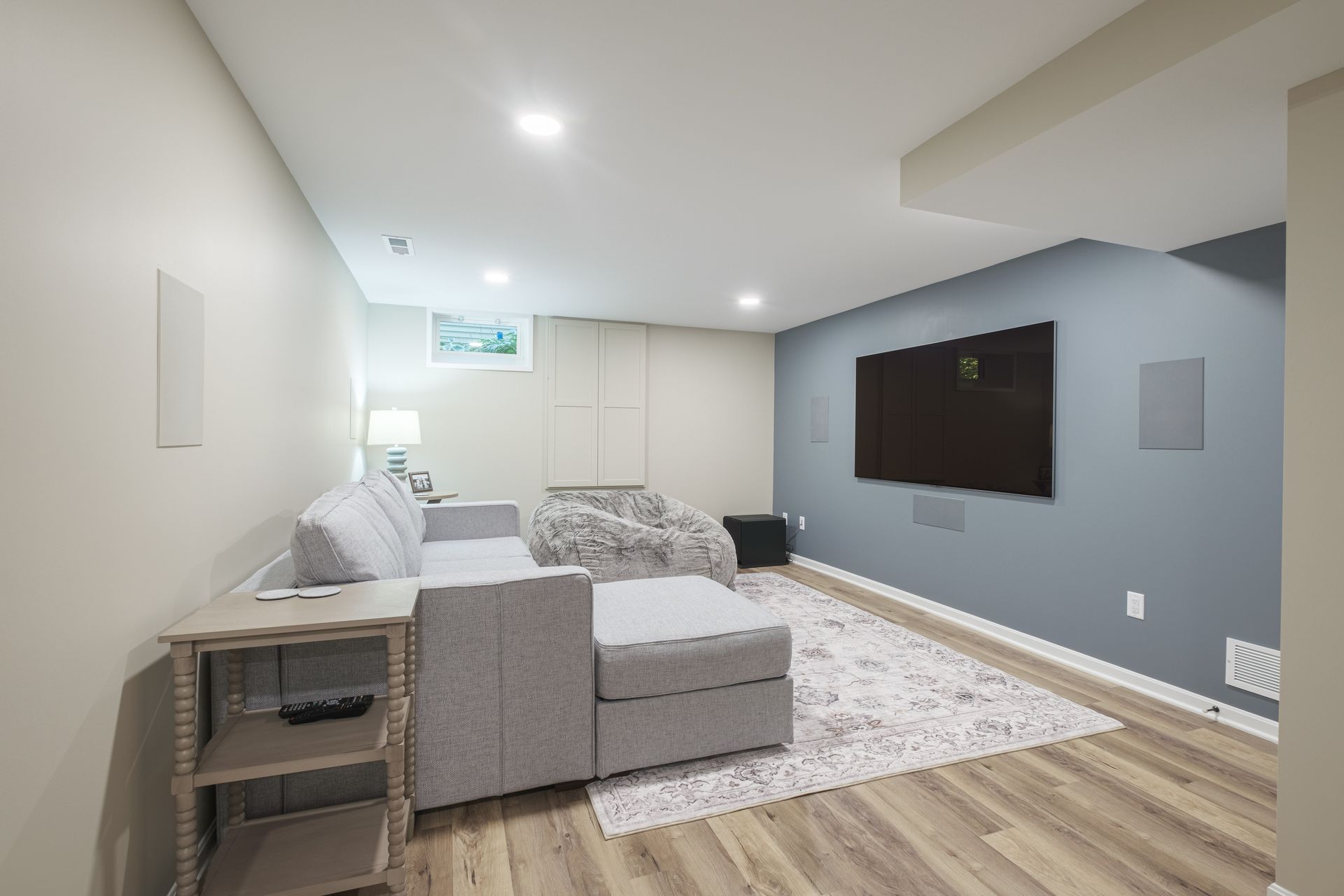 A living room with a couch and a flat screen tv.