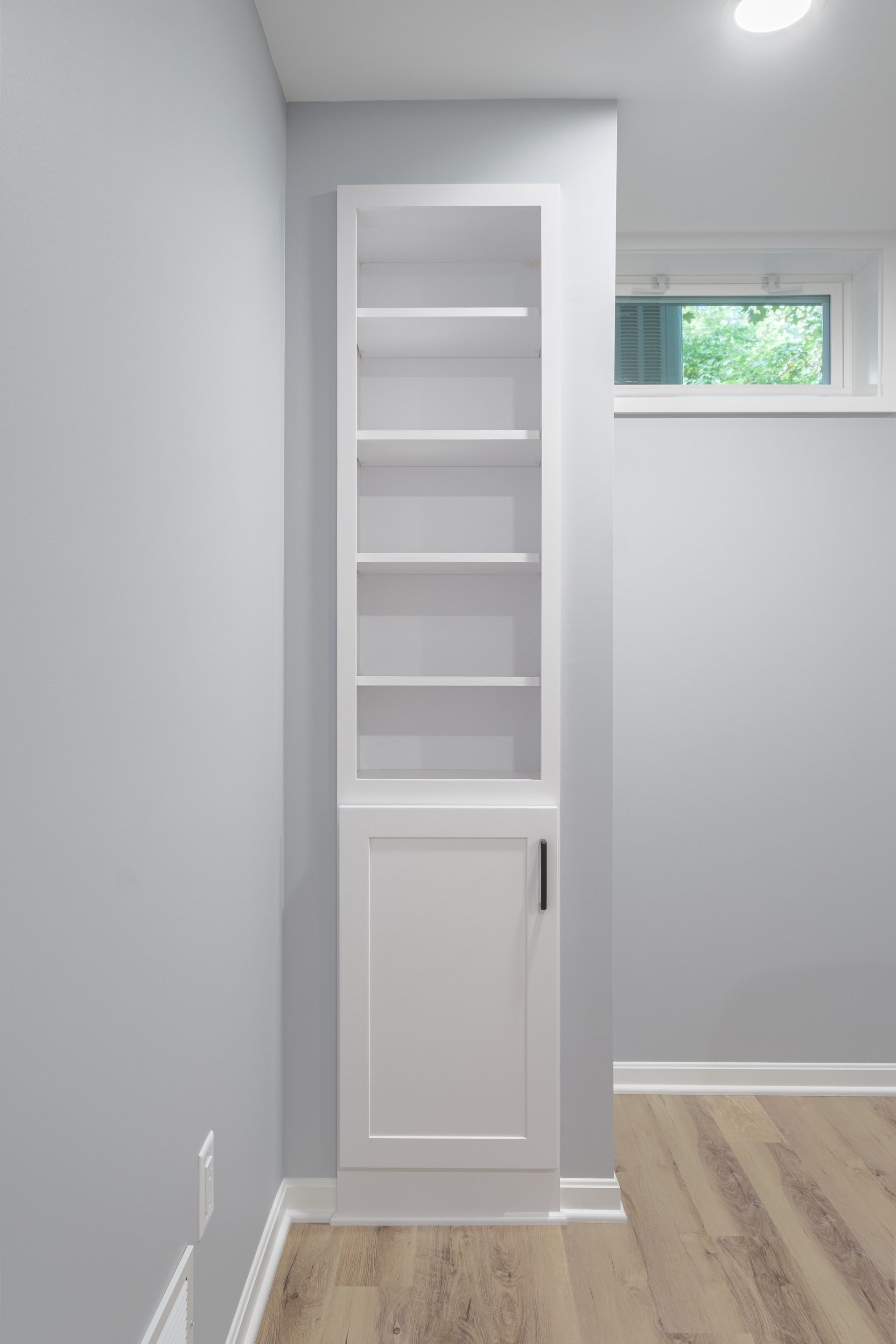 There is a bookshelf in the corner of the room.