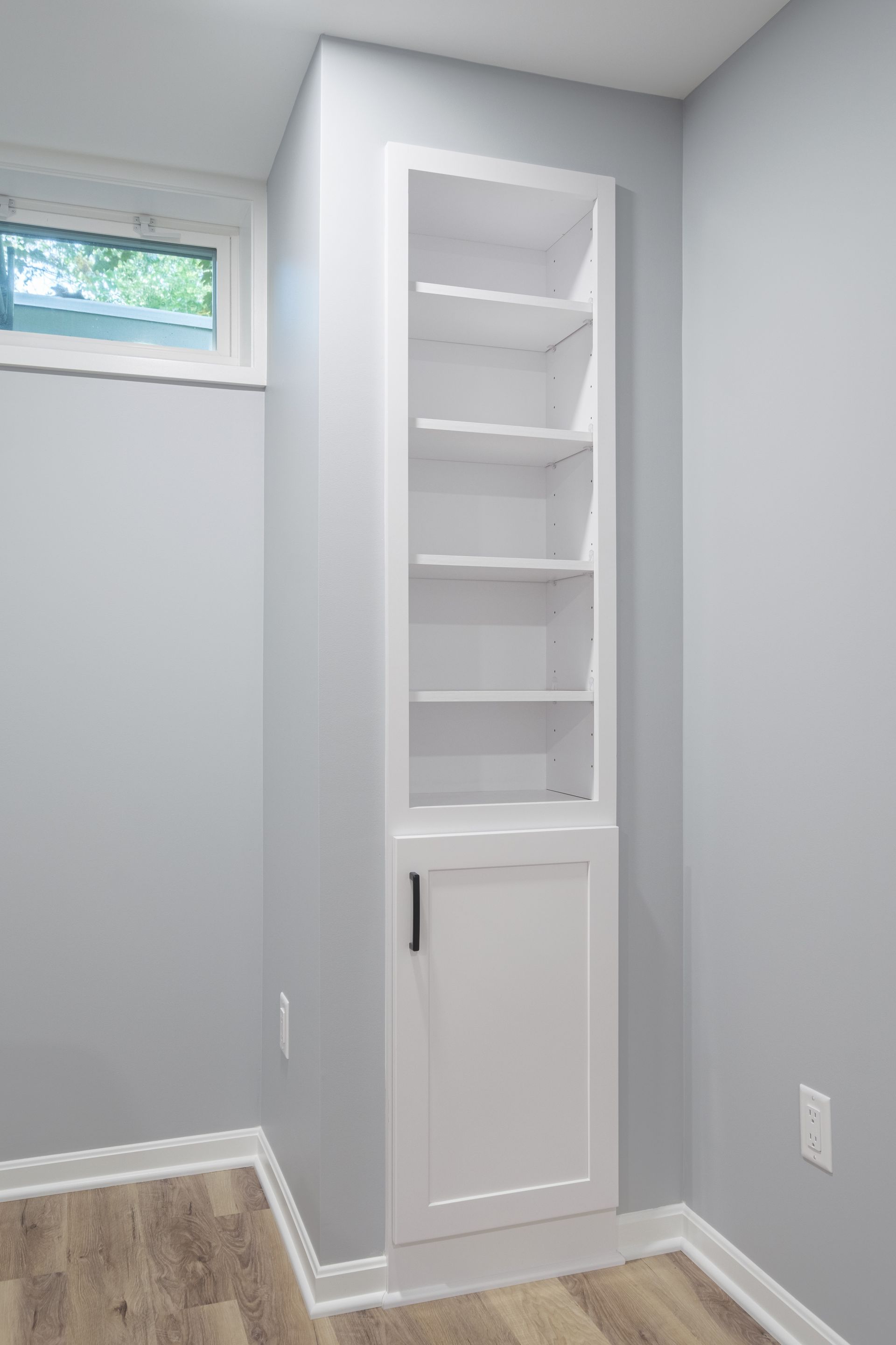 There is a bookshelf in the corner of the room.