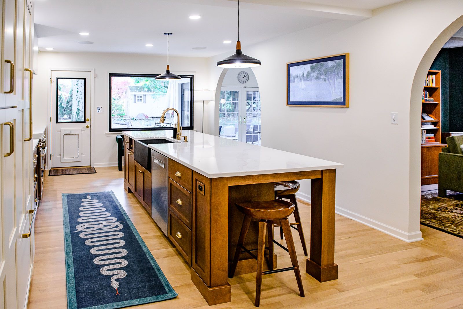 There is a large island in the middle of the kitchen.