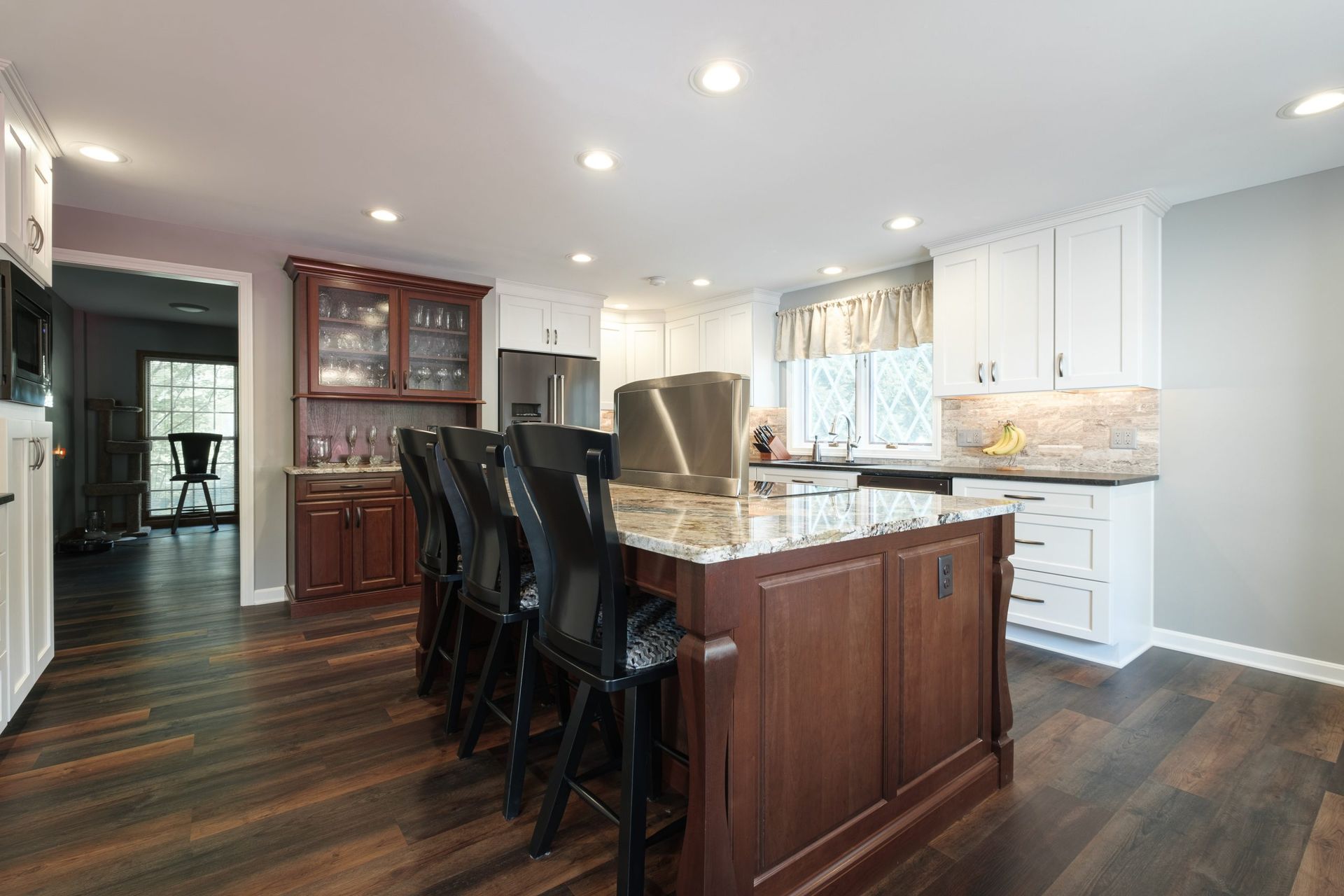 There is a large island in the middle of the kitchen.