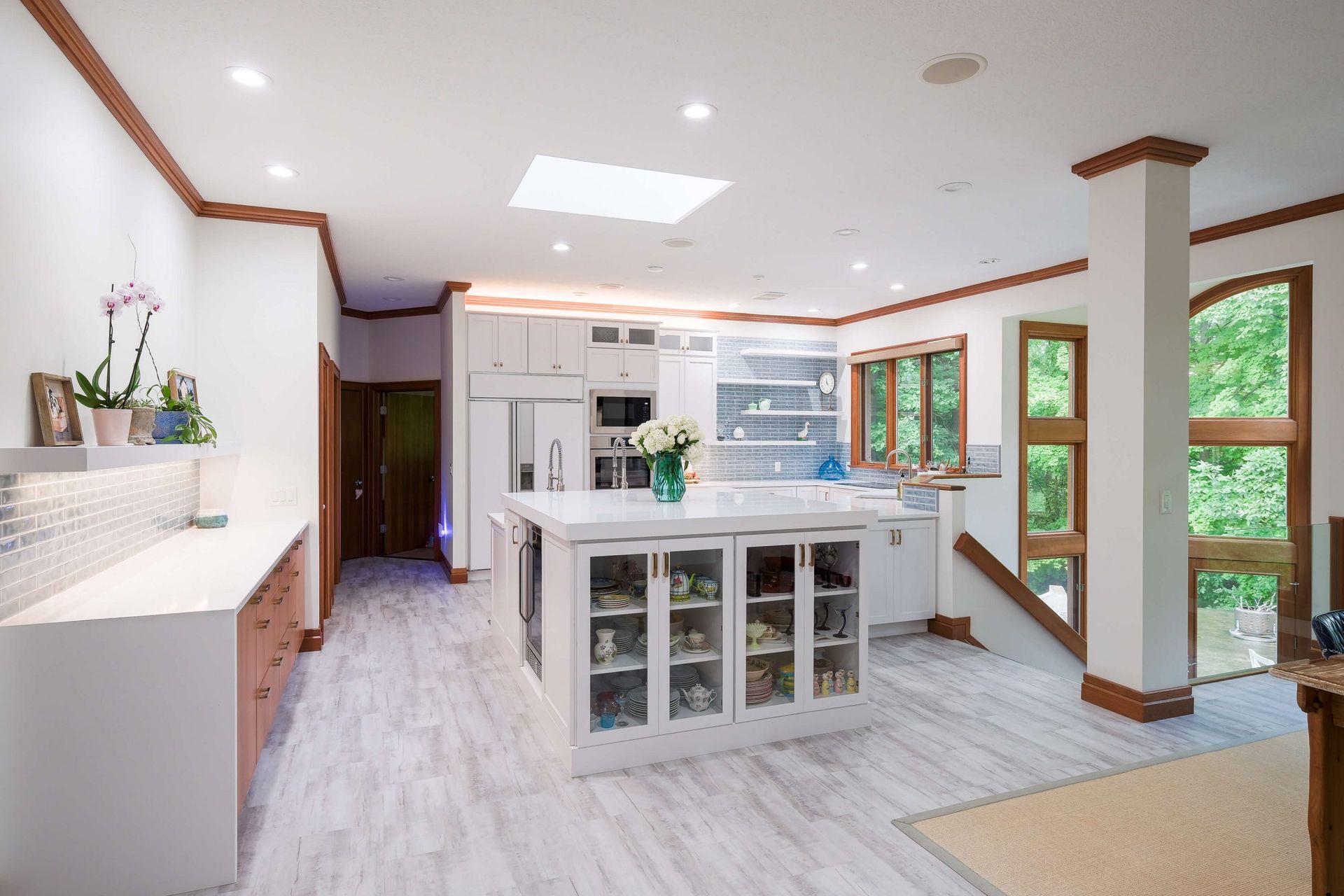 A kitchen with a large island in the middle of the room.