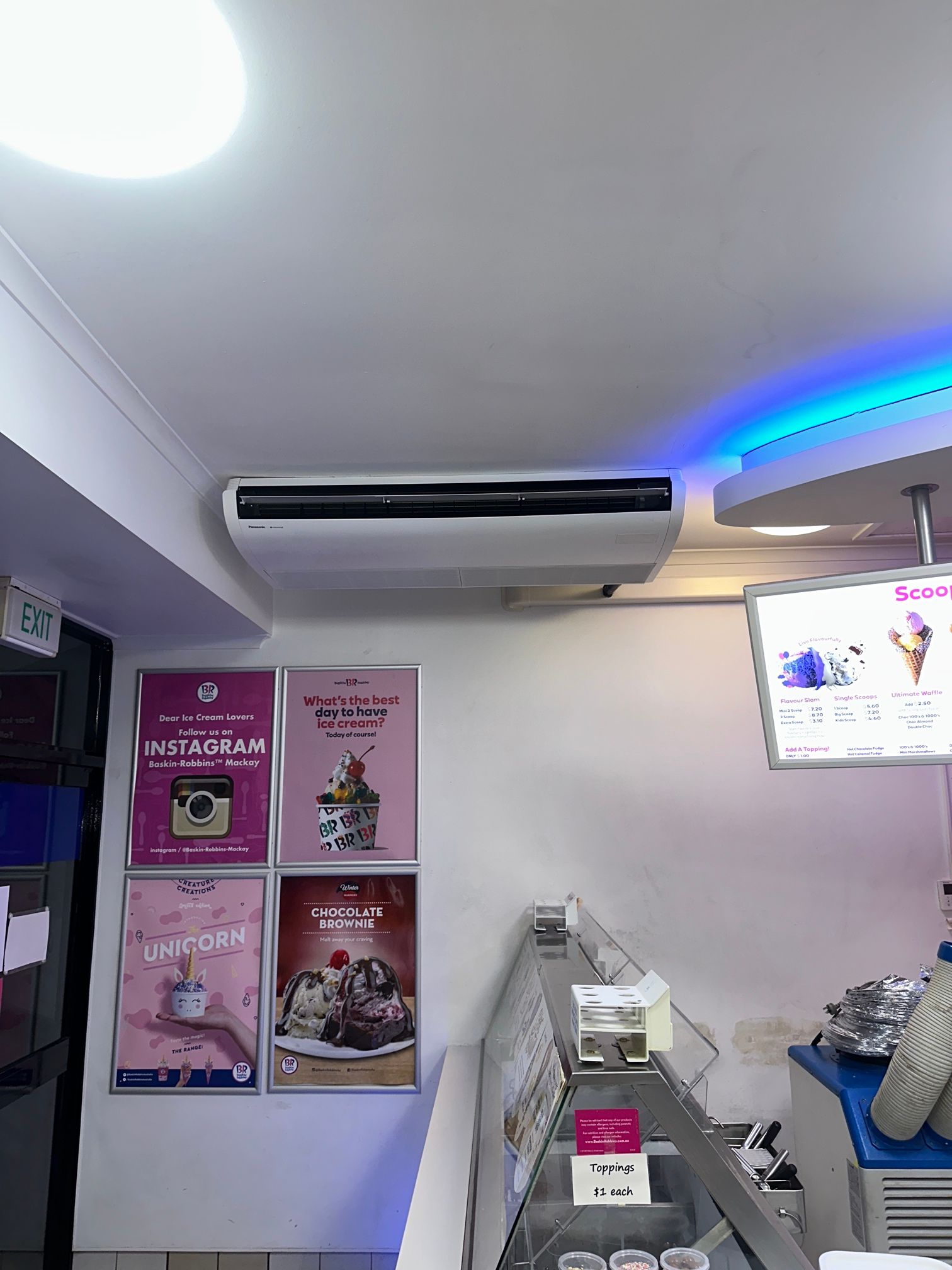 Ceiling of a Cafe With Exposed Pipes, Lights, and Air Conditioning Units — LSEA Electrical Group in Bucasia, QLD