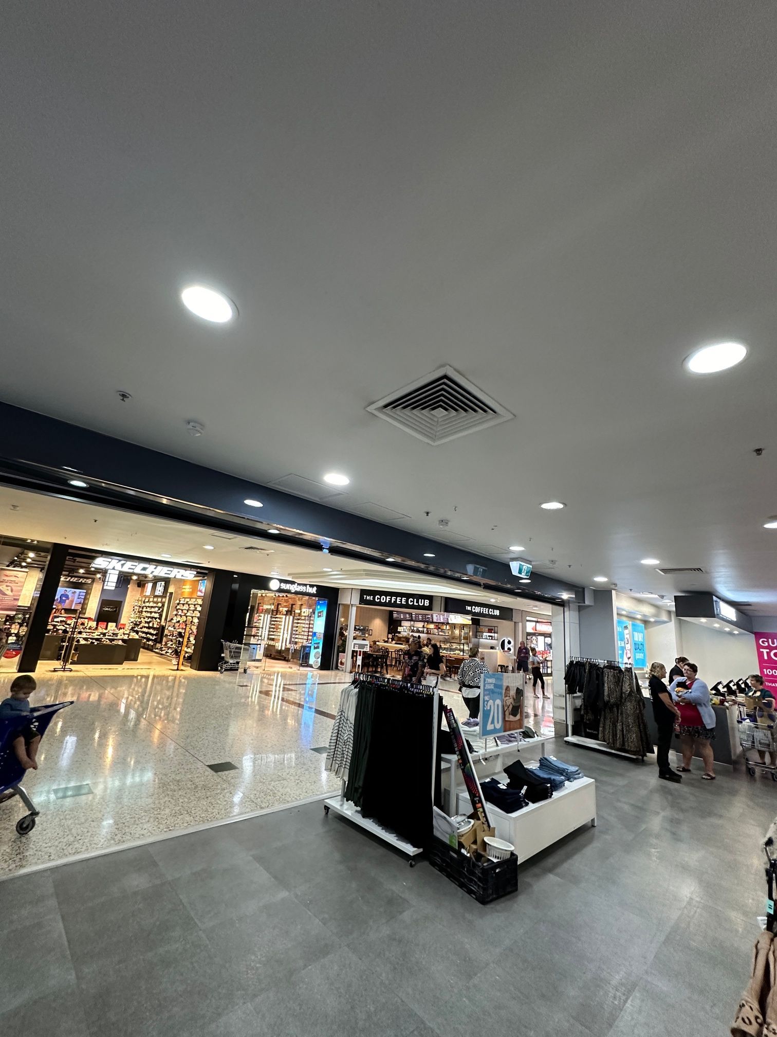 Mall Interior With Shops, Bright Lighting, Tiled Floors, Display in Foreground — LSEA Electrical Group in Paget, QLD
