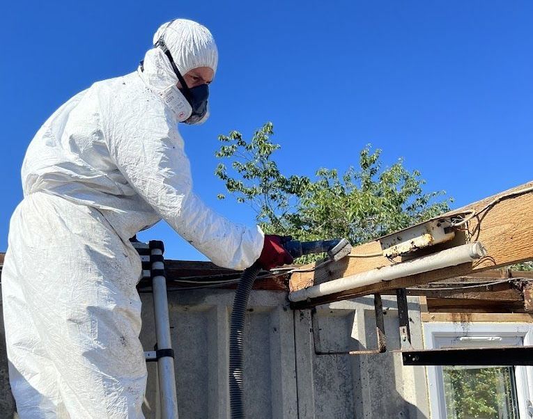 Technician with asbestos testing kit for Scotland refurb survey