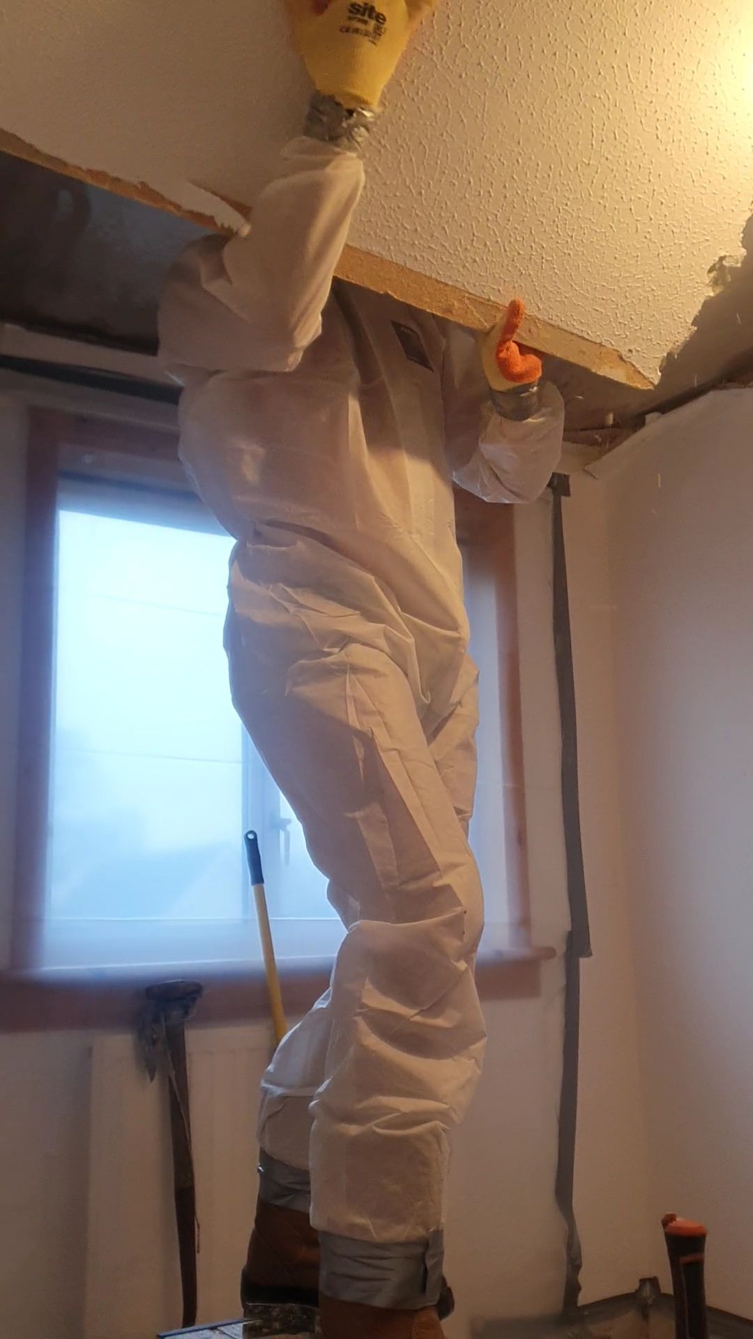 professional checking for asbestos in artex ceiling
