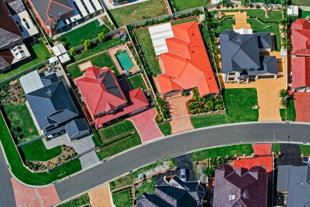 An aerial view of a residential area with lots of houses and driveways.