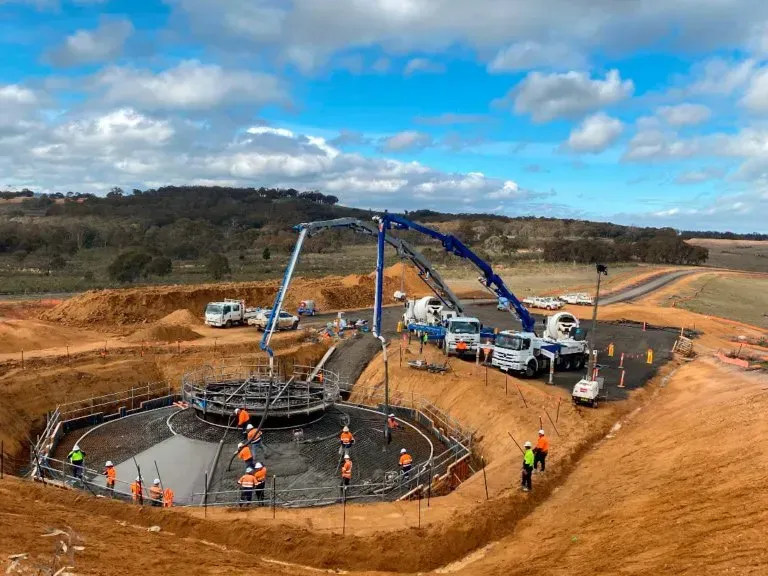 A group of people are working on a construction site.