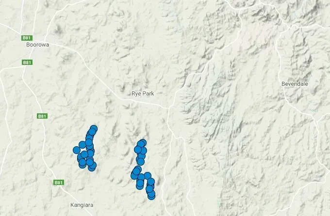 A map of a mountain range with blue dots on it.
