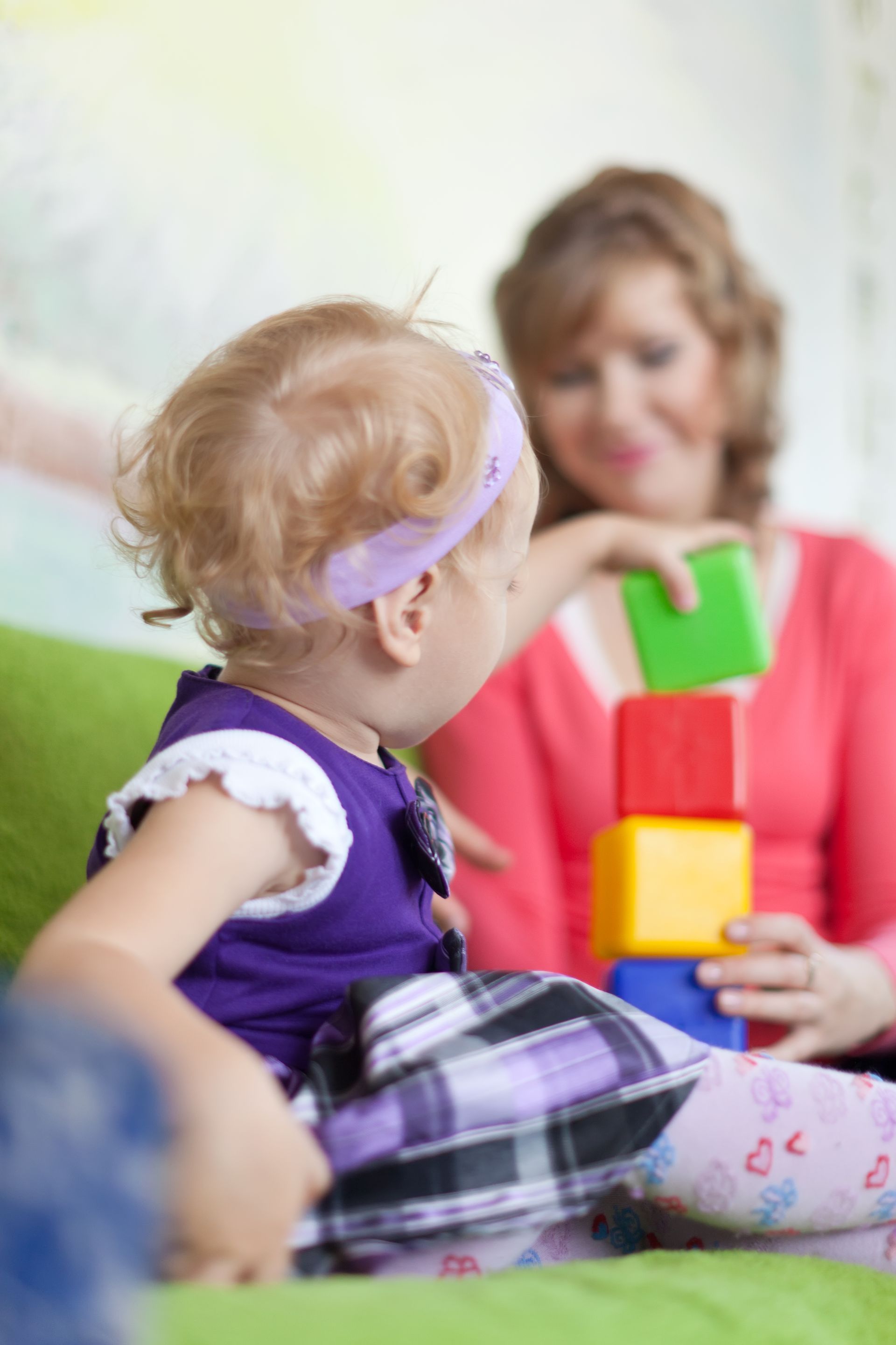 A woman and a little girl during an in home ABA therapy session