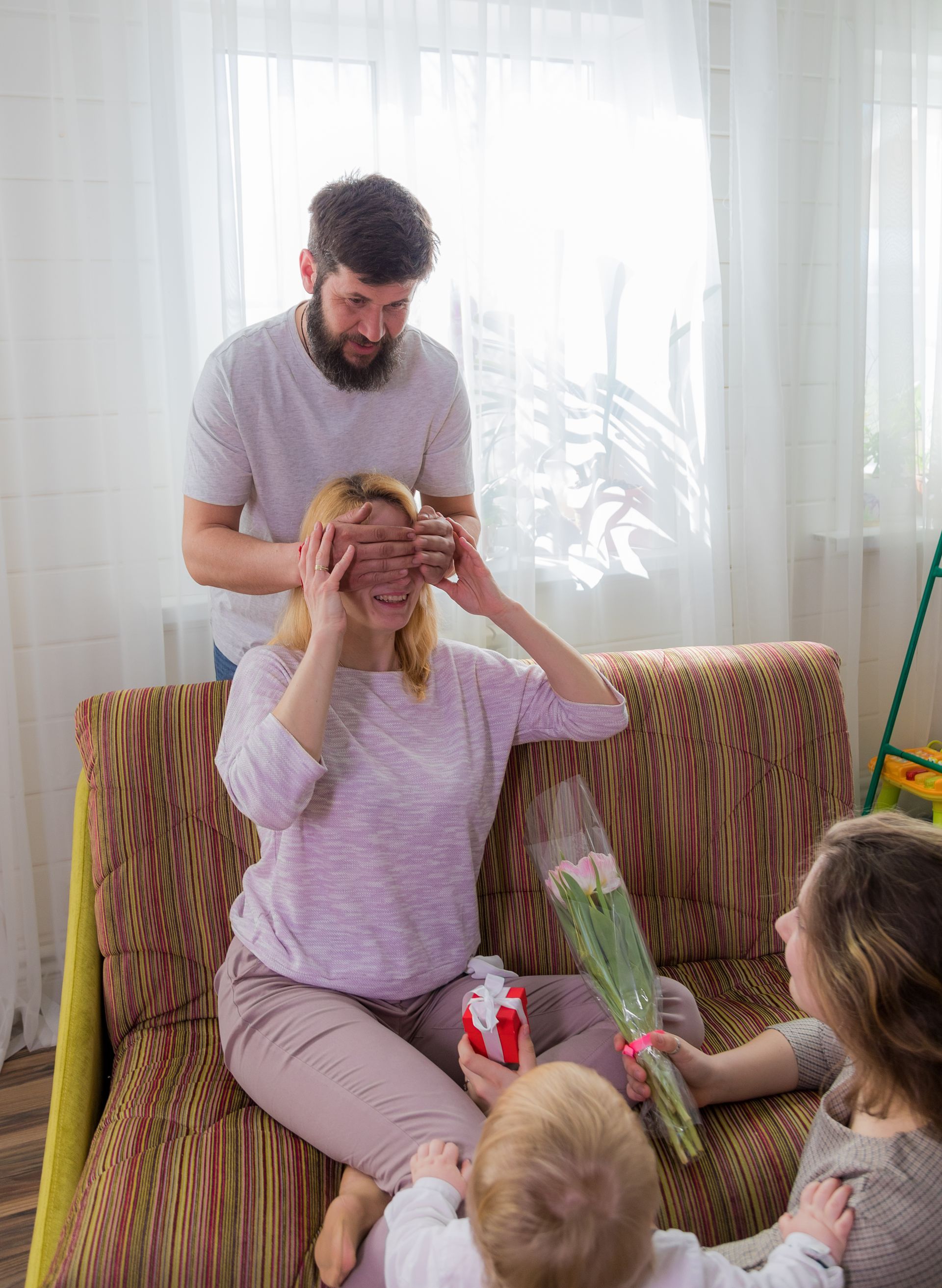 An RBT and a child are playing with blocks on the floor during an in-home aba therapy session