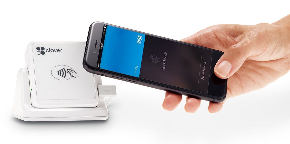 A person is holding a cell phone in their hand.