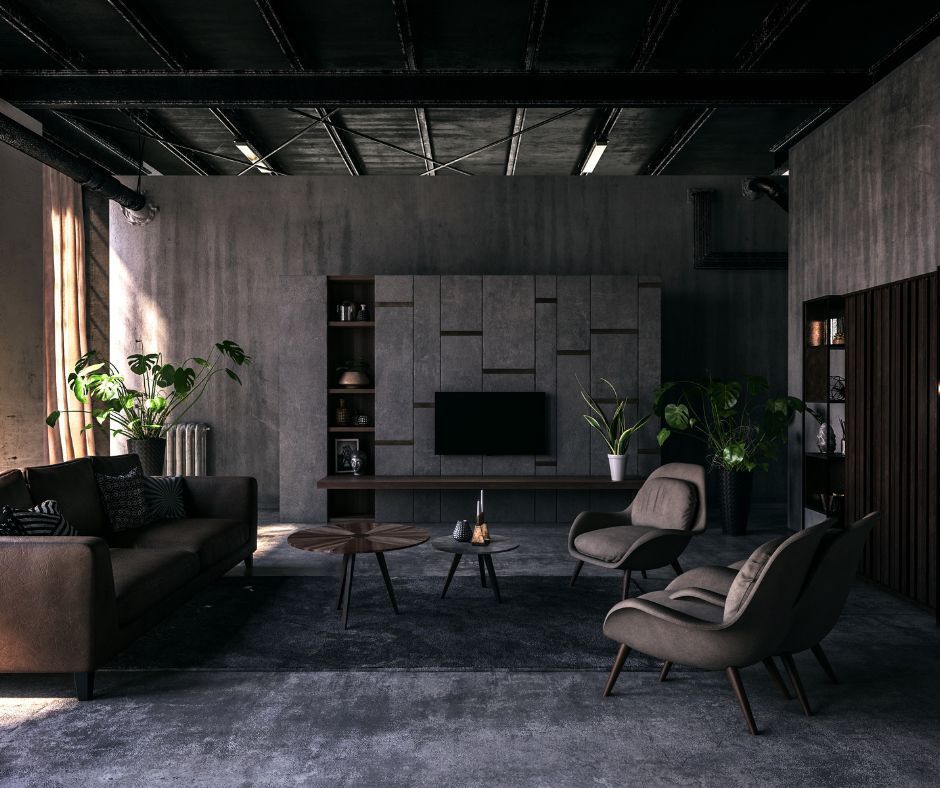 A modern, industrial-style living room with dark gray concrete walls, a black ceiling, a sofa, and two armchairs.
